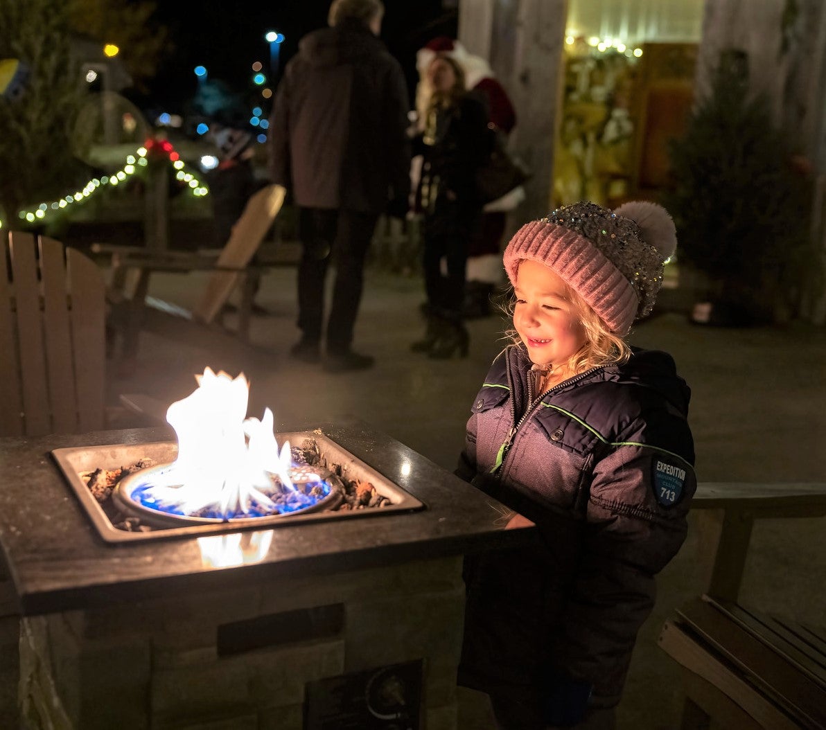 Young girl in front of fire at Frosty's Cantina