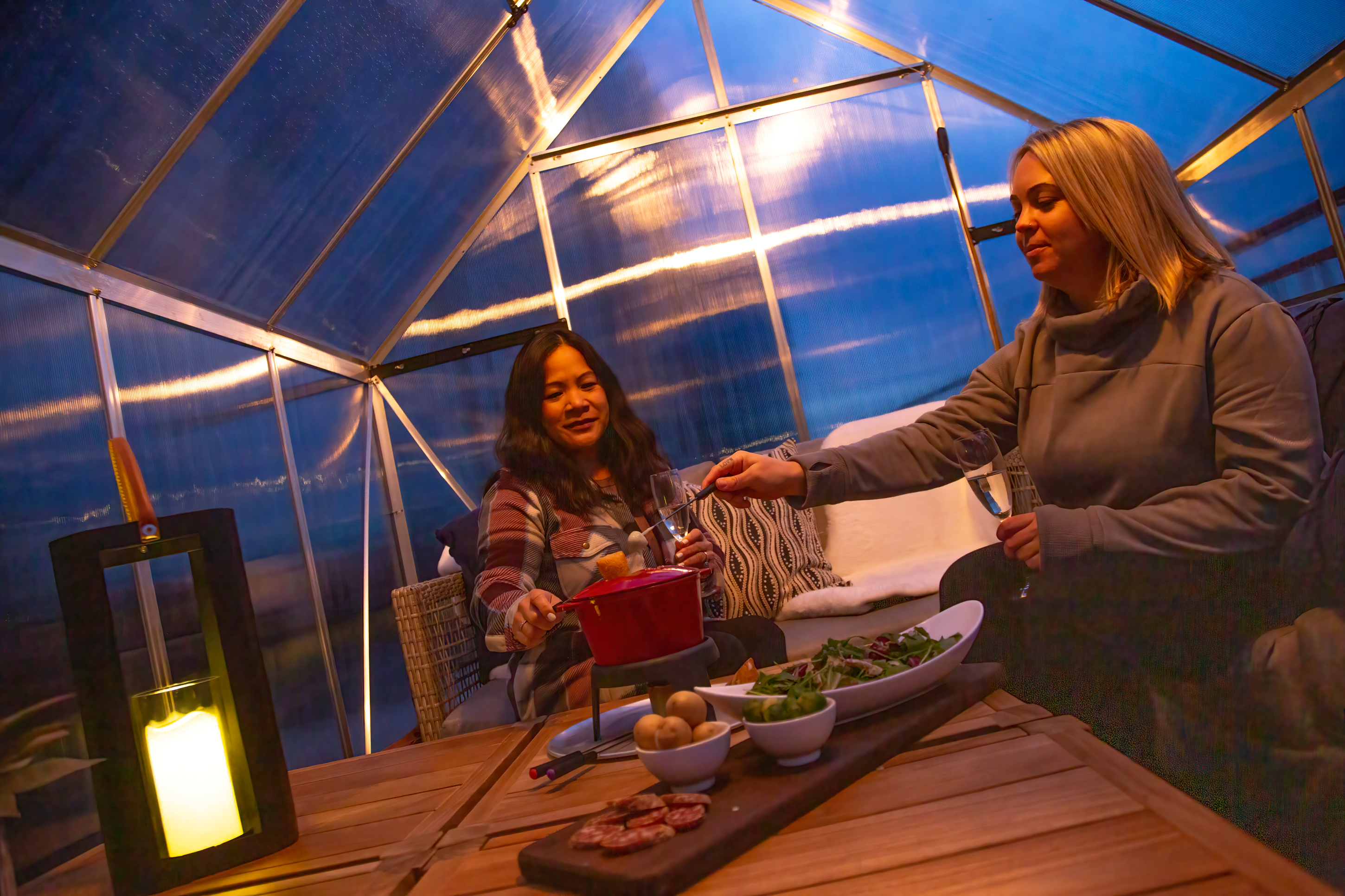 Girlfriends enjoying fondue in Champagne Chalets