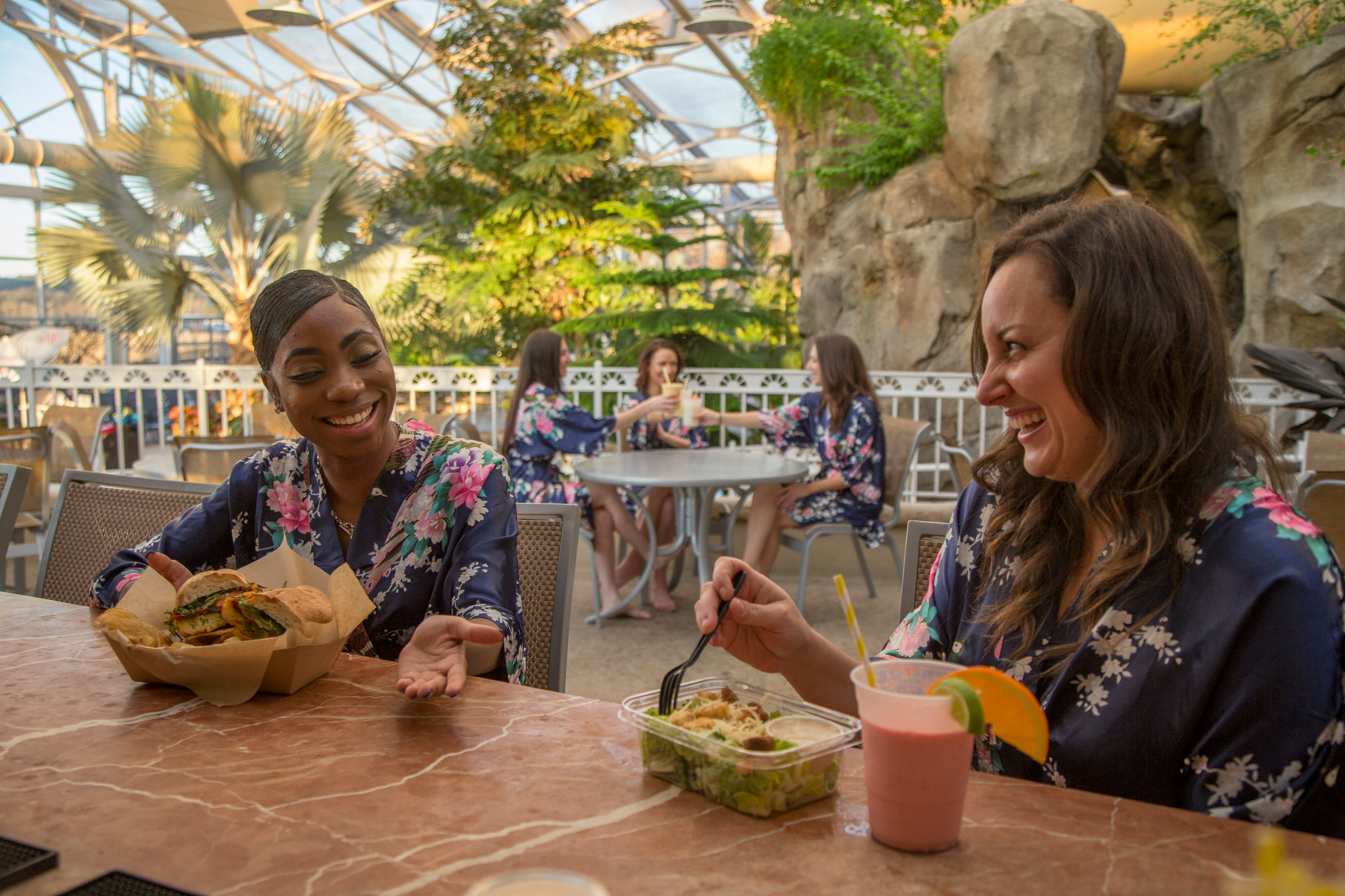 Two women eating at Biosphere cafe.