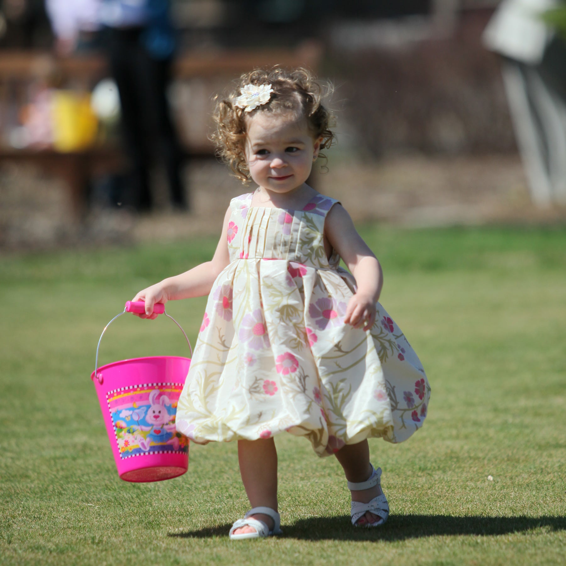 Young girl doing an easter egg hunt.
