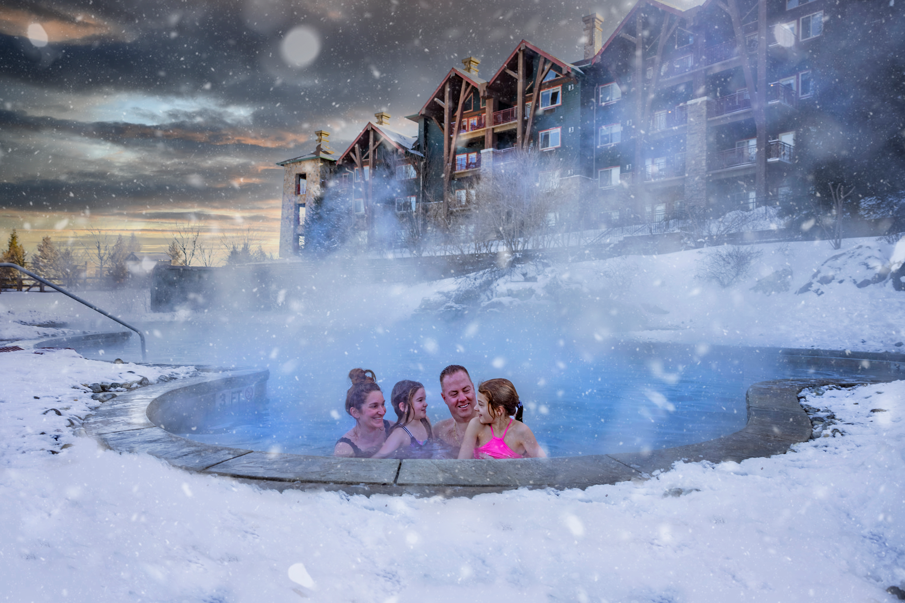 Family enjoying snow pool at Grand Cascades Lodge