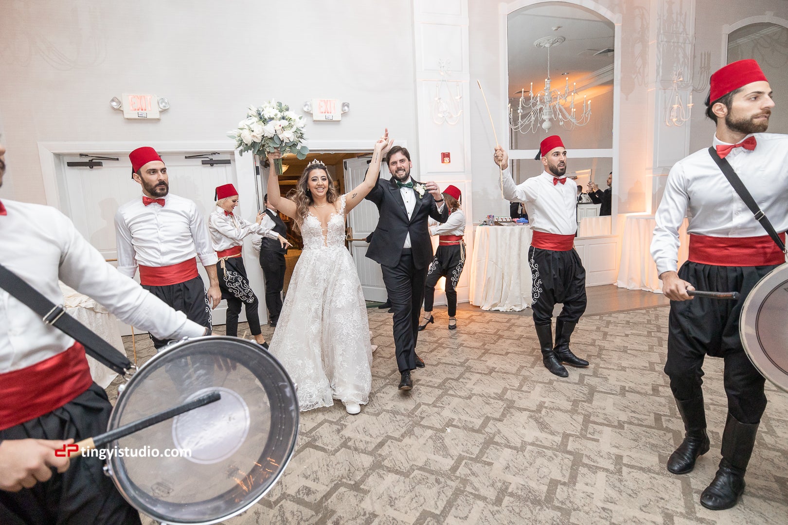 Bride and groom making entrance to wedding reception