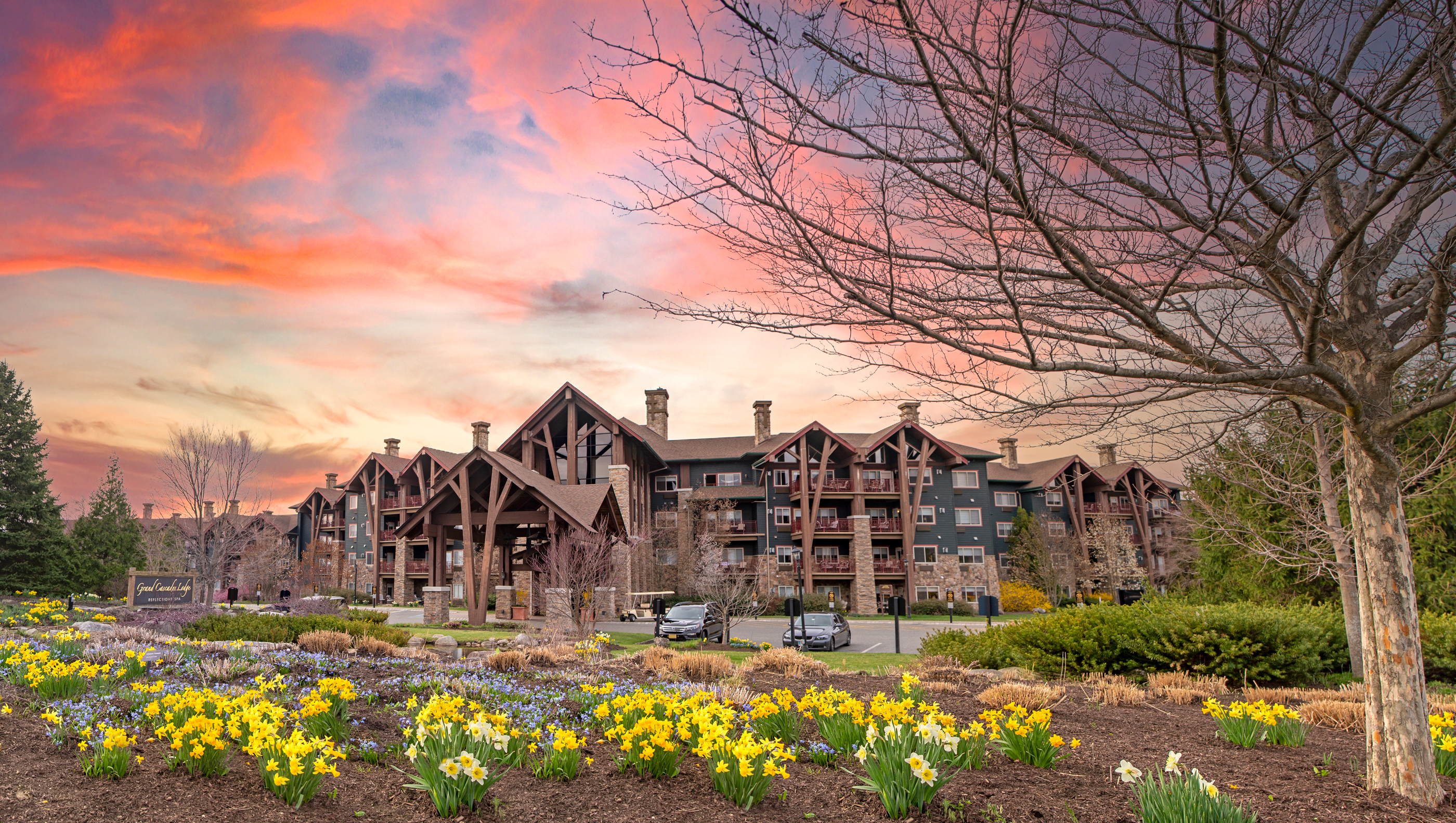 Grand Cascades Lodge exterior with beautiful sunset