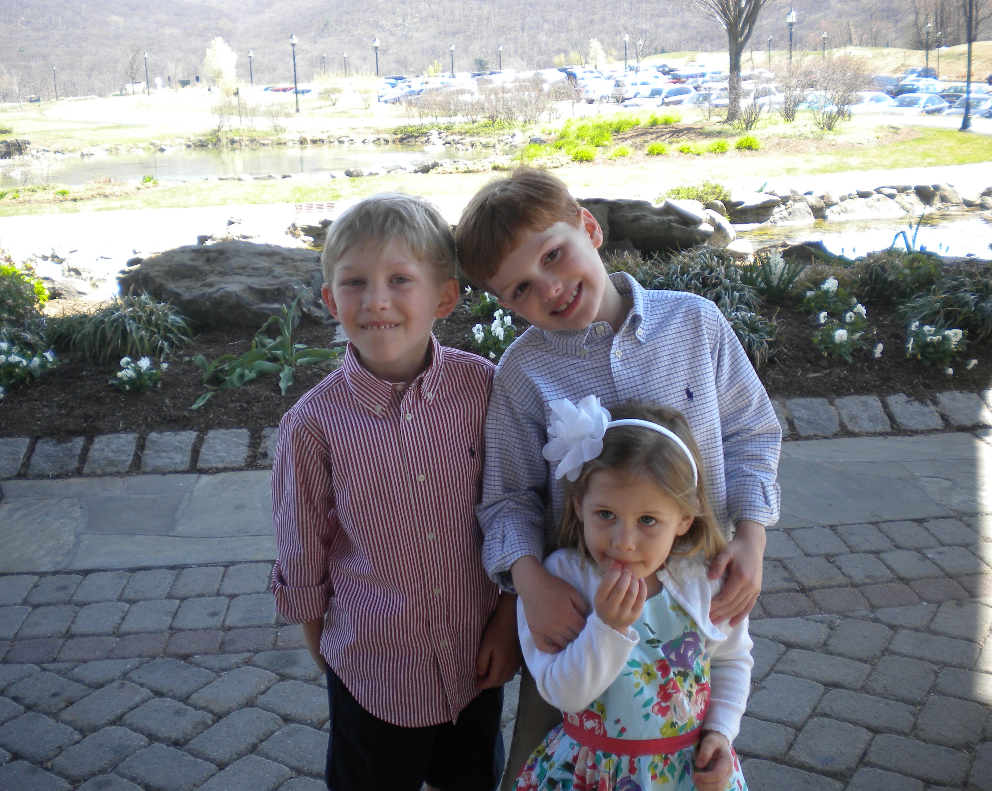 Three children standing together.