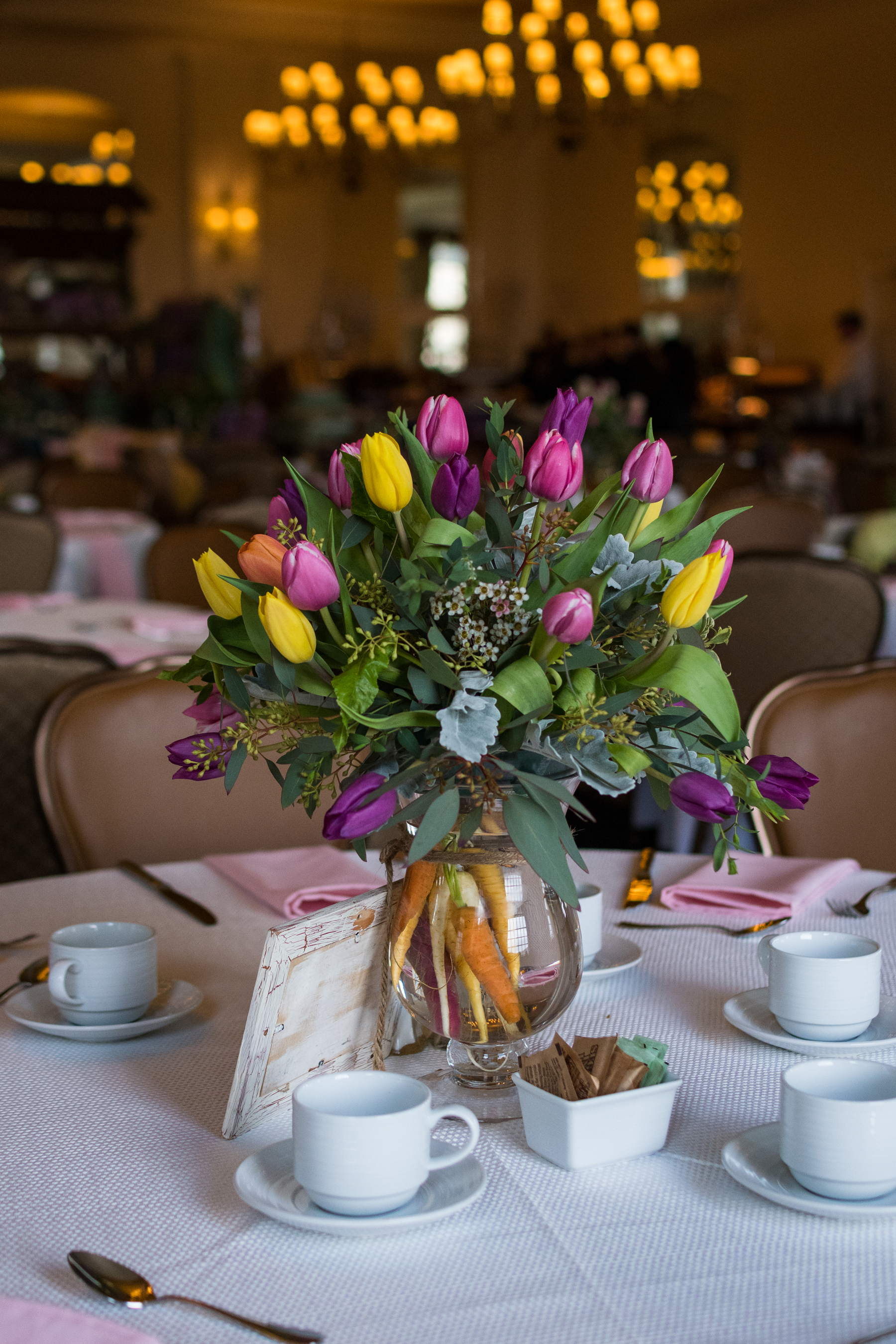 Tulips in middle of round table.