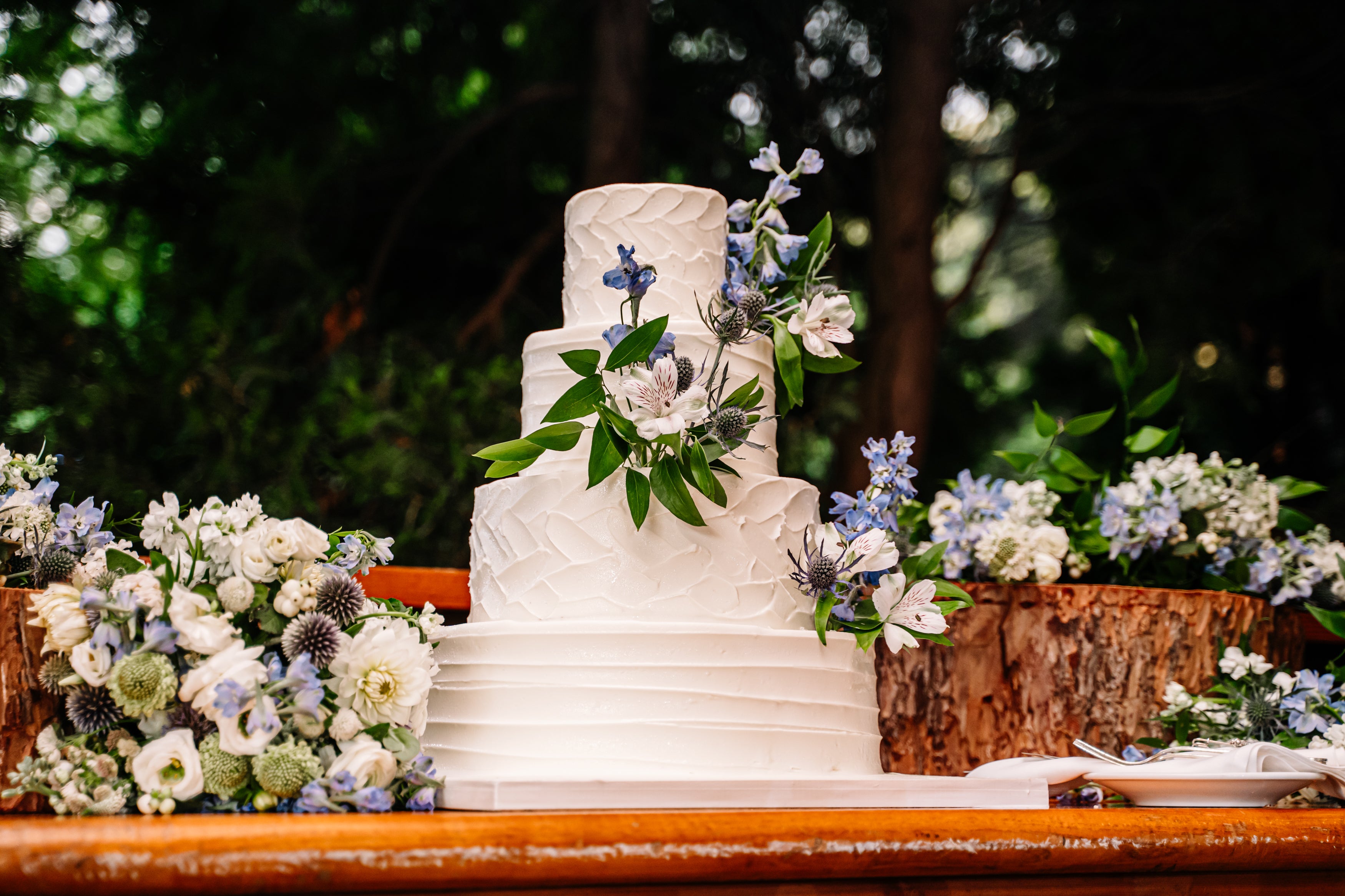 Wedding cake with blue and white flowers 