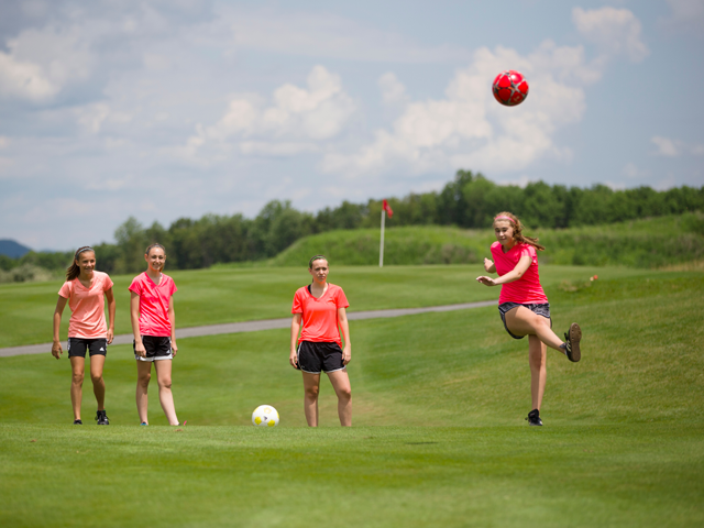 Four girls playing foot golf at a resort close to New York City