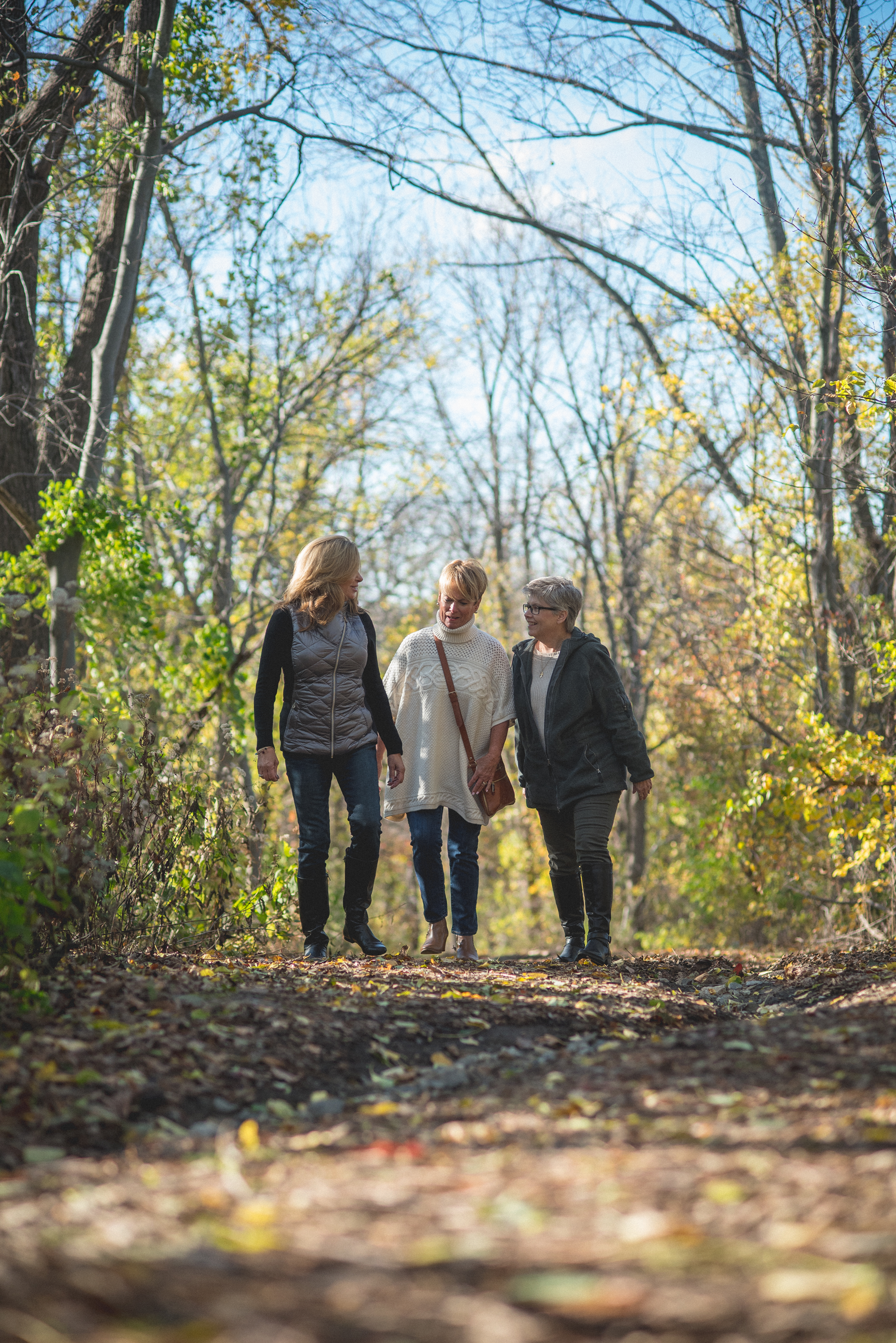 Women walking through a hiking trail in the forest