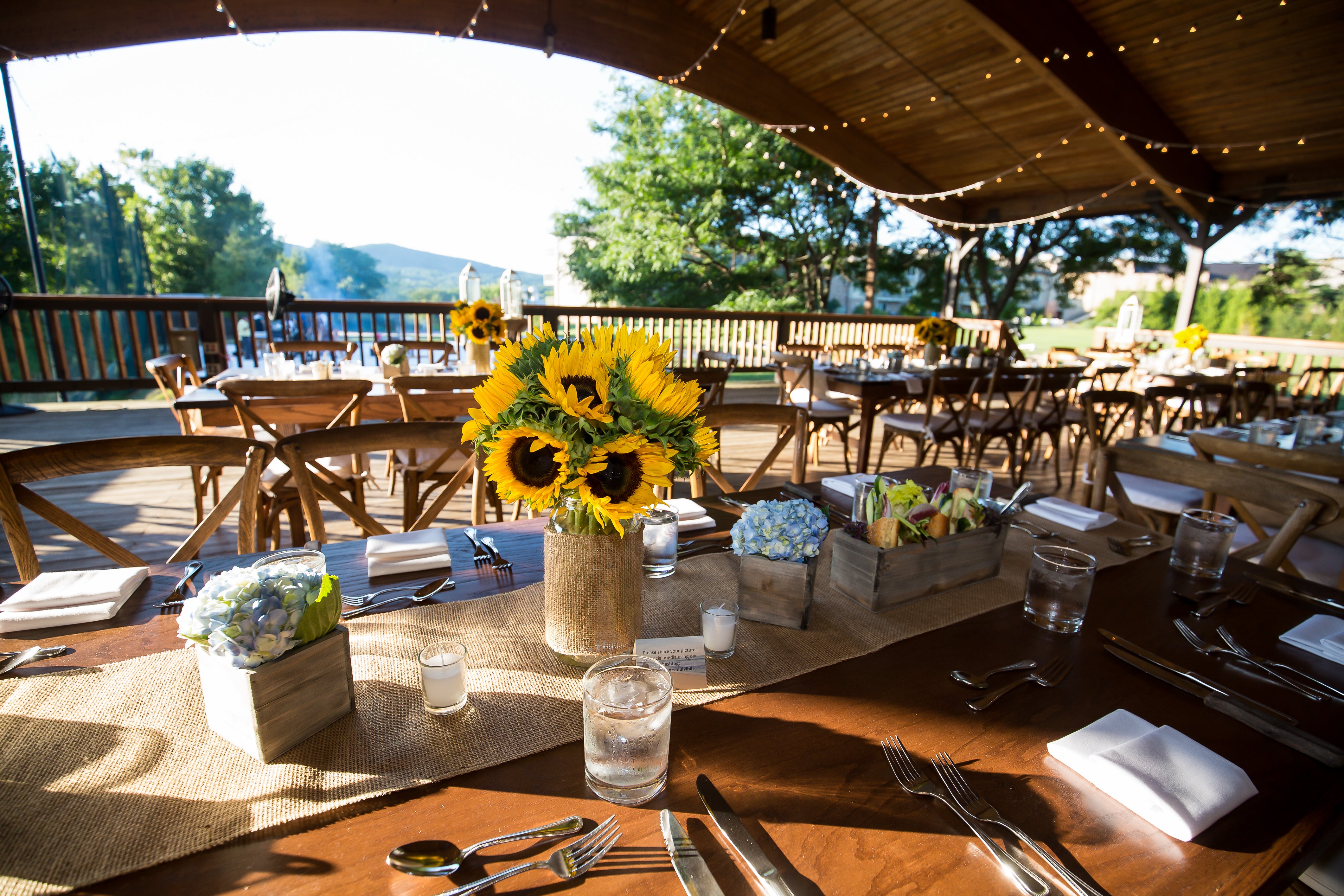 Sweetgrass Pavillion wedding set up with sunflower centerpieces