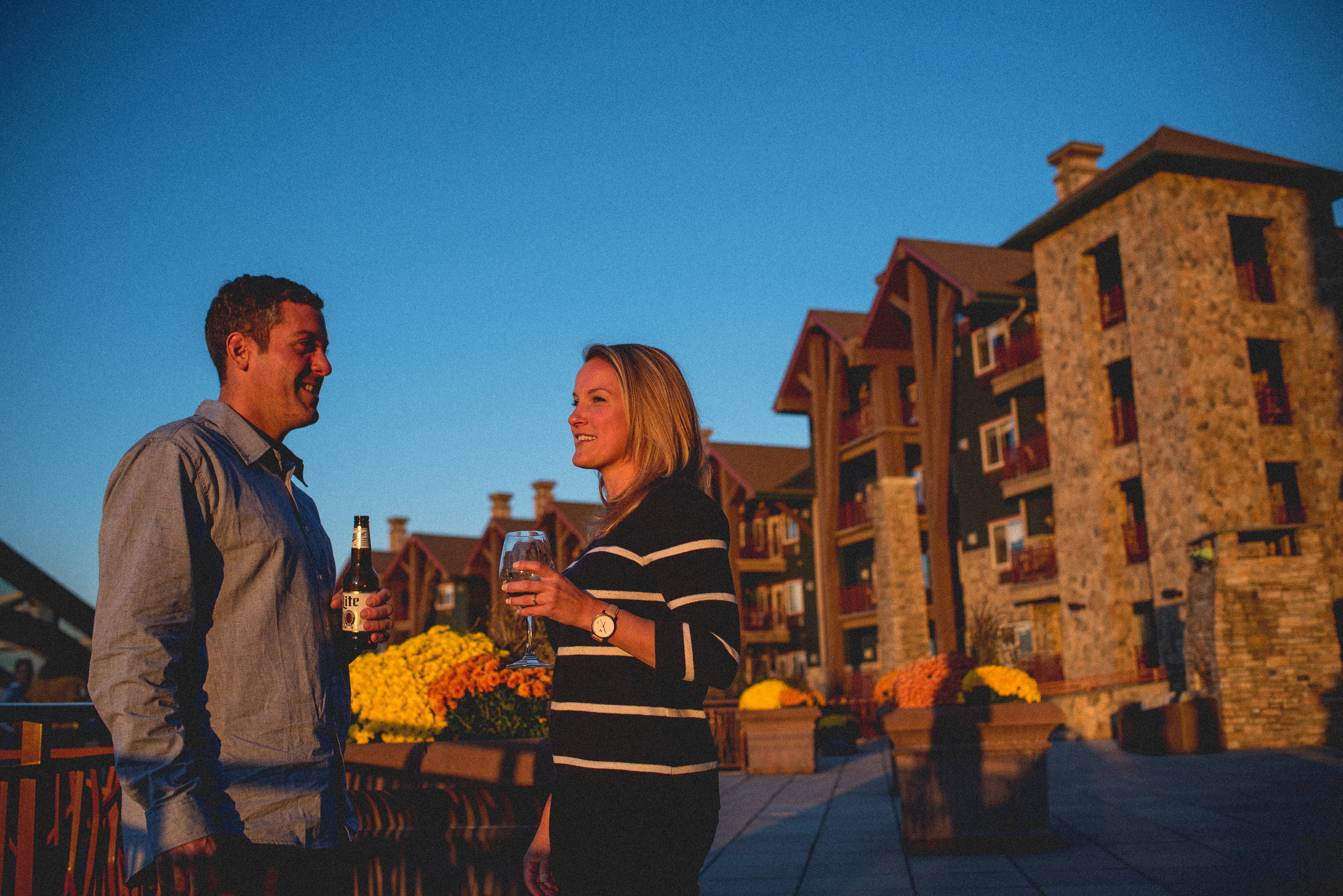 Couple enjoying the sunset on the terrace at Grand Cascades Lodge