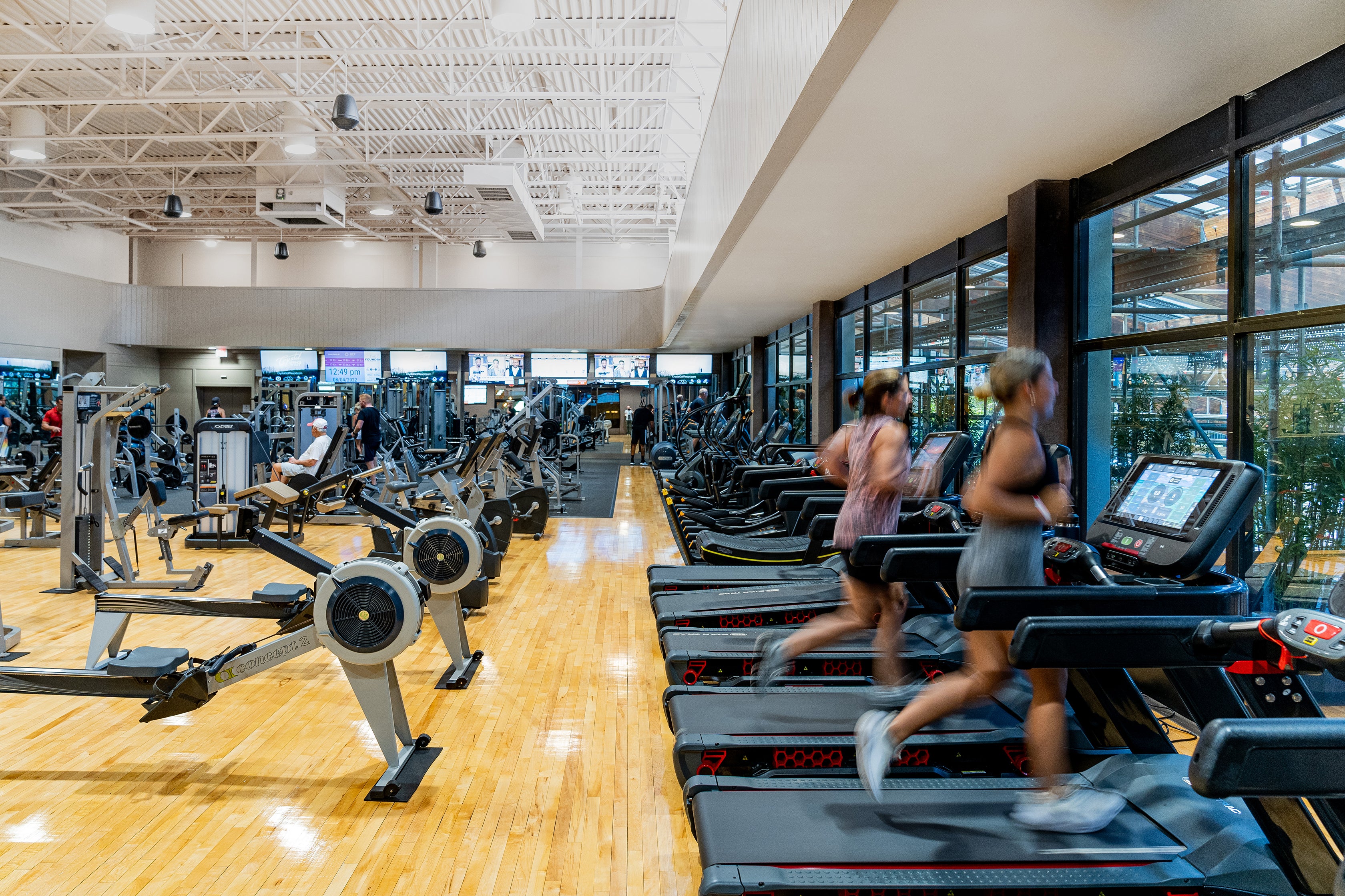 Two women running on treadmills at Minerals Sports Club.