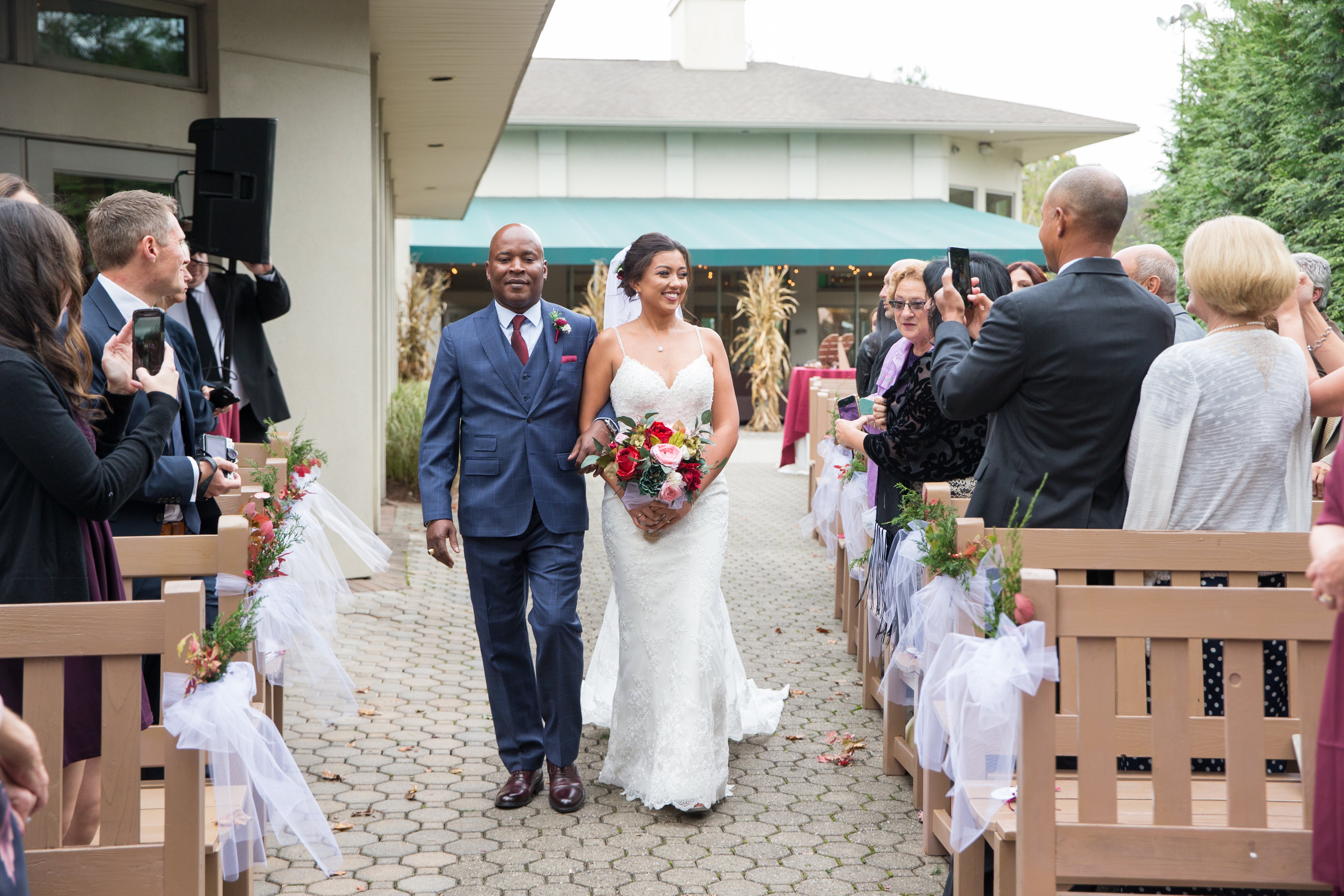 Dad walking the bride down the isle at black bear golf club.
