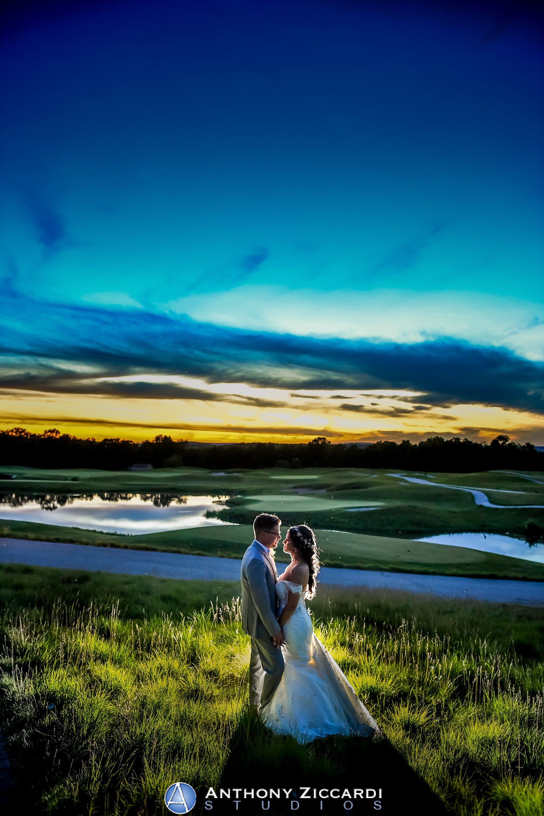 Bride and groom on Ballyowen Golf Course at sunset