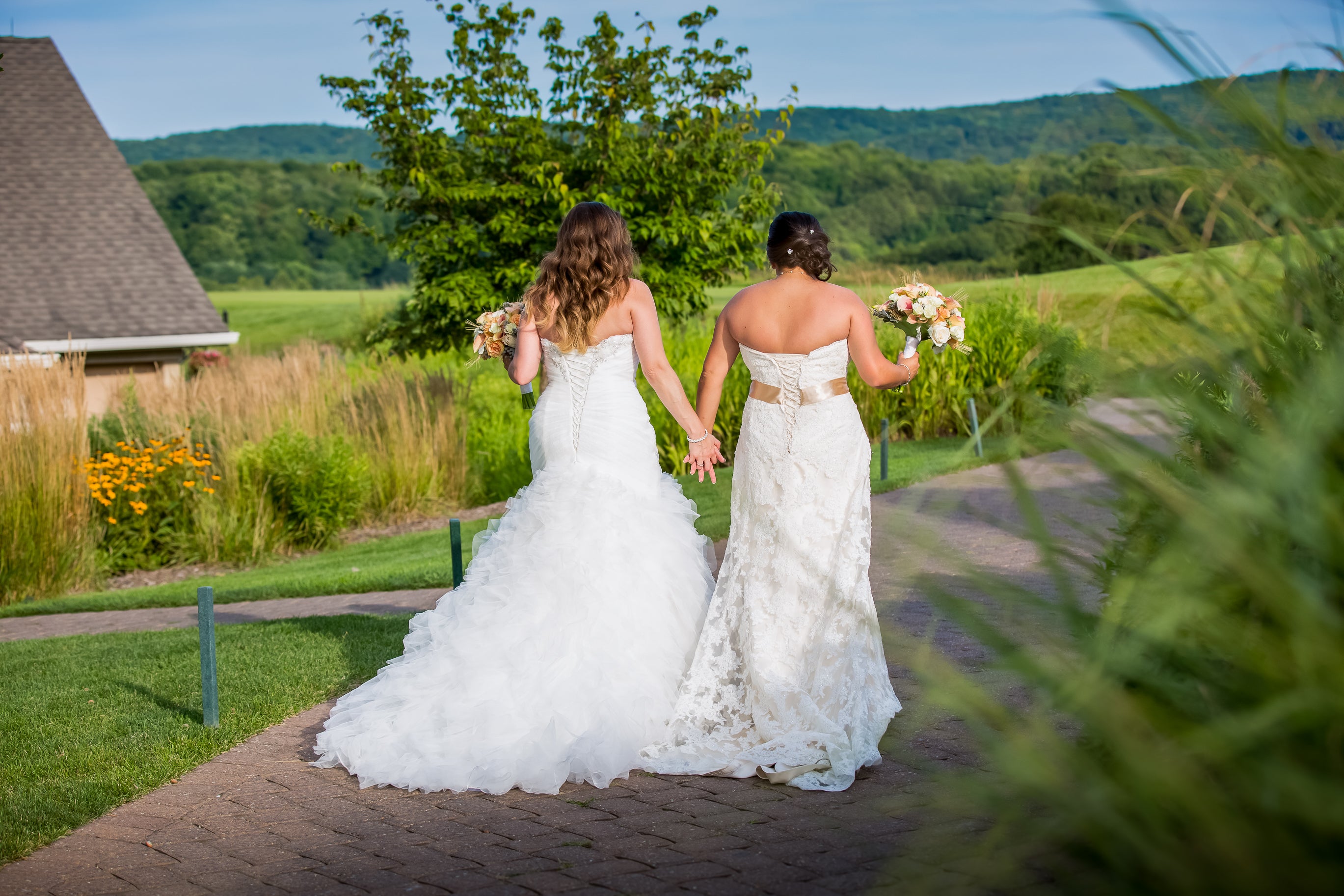 Two Brides walking together at Ballyowen at Crystal Springs Resort