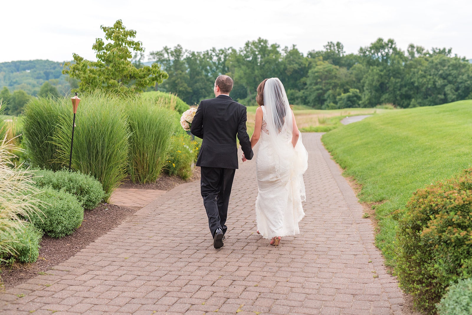 Wedding couple walking the grounds at Ballyowen Golf Course