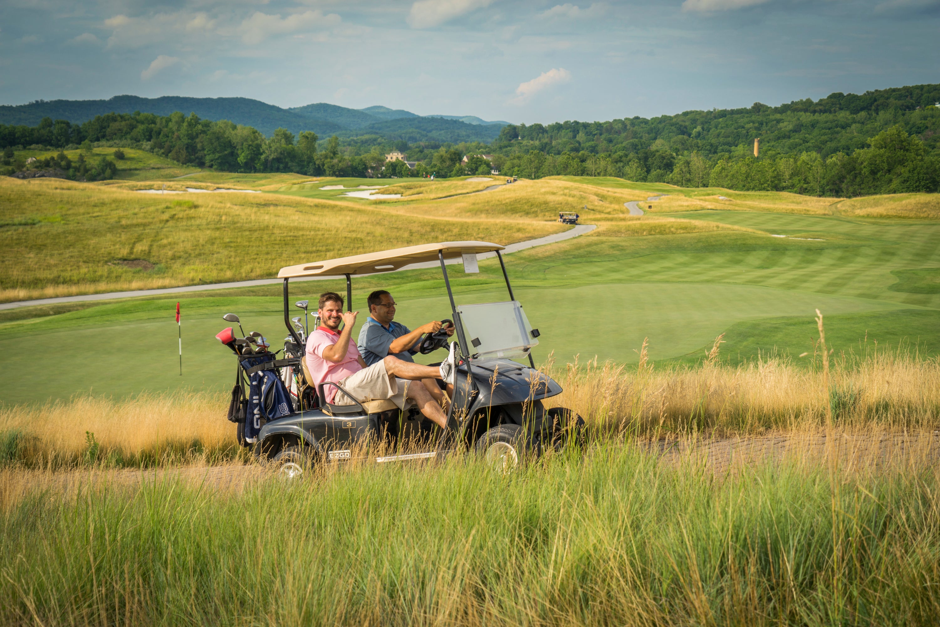 Men on golf cart