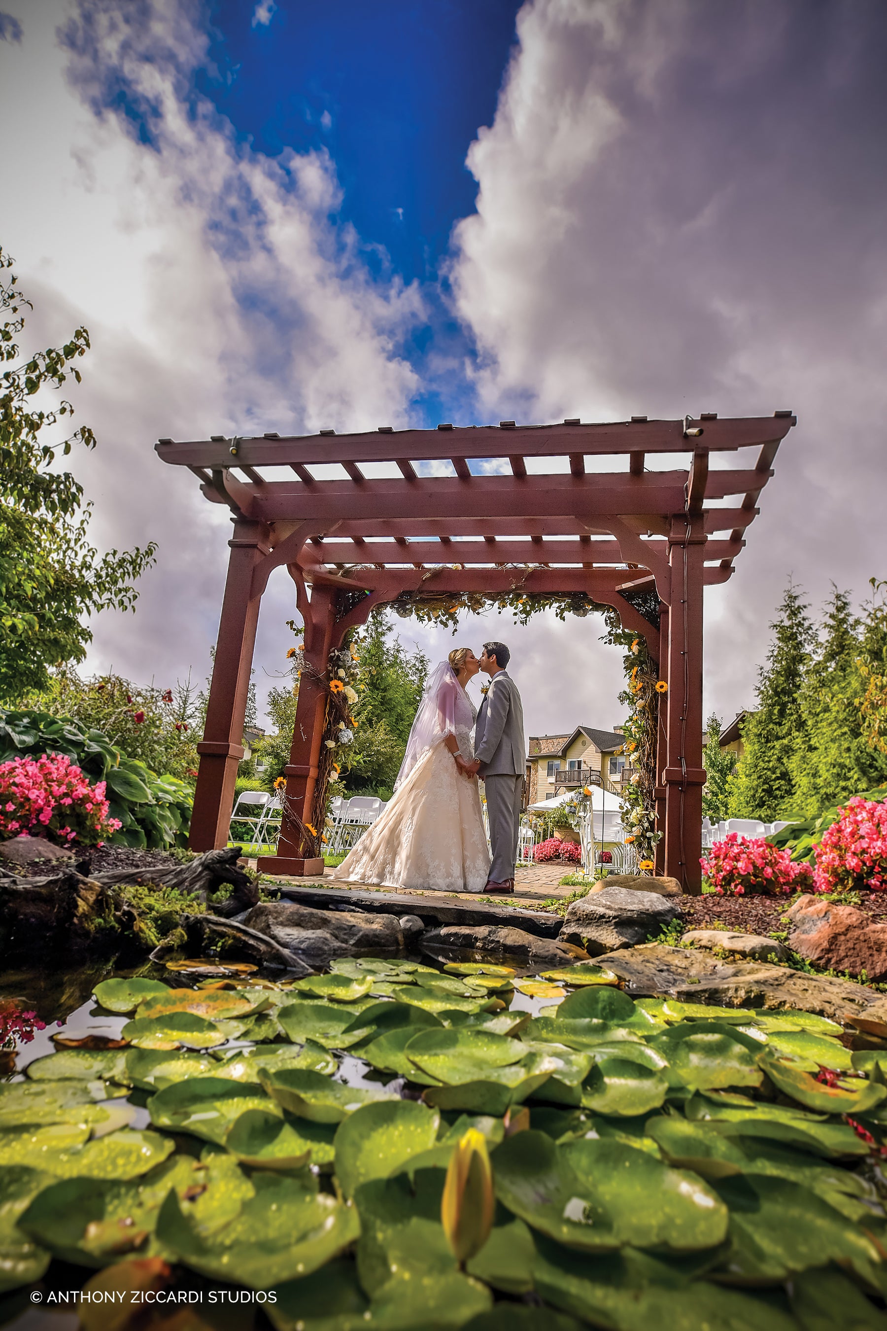 Wedding couple kissing under alter