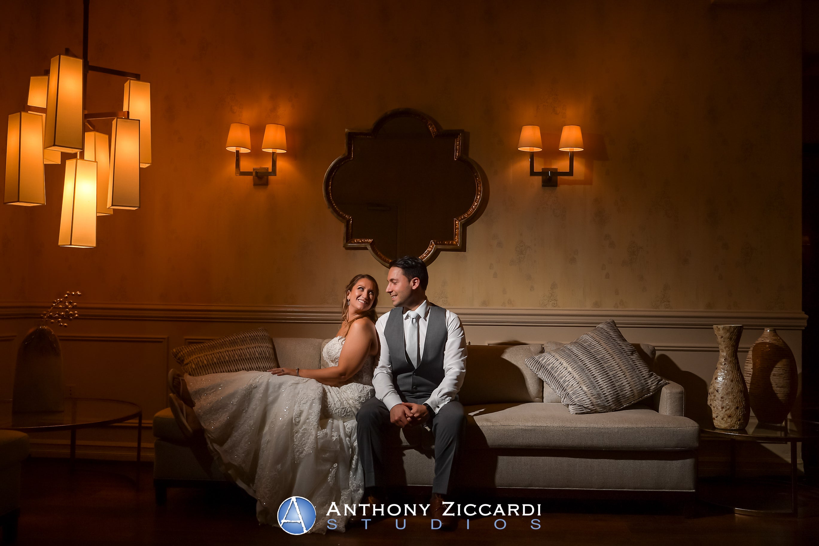 Bride and Groom sitting on couch