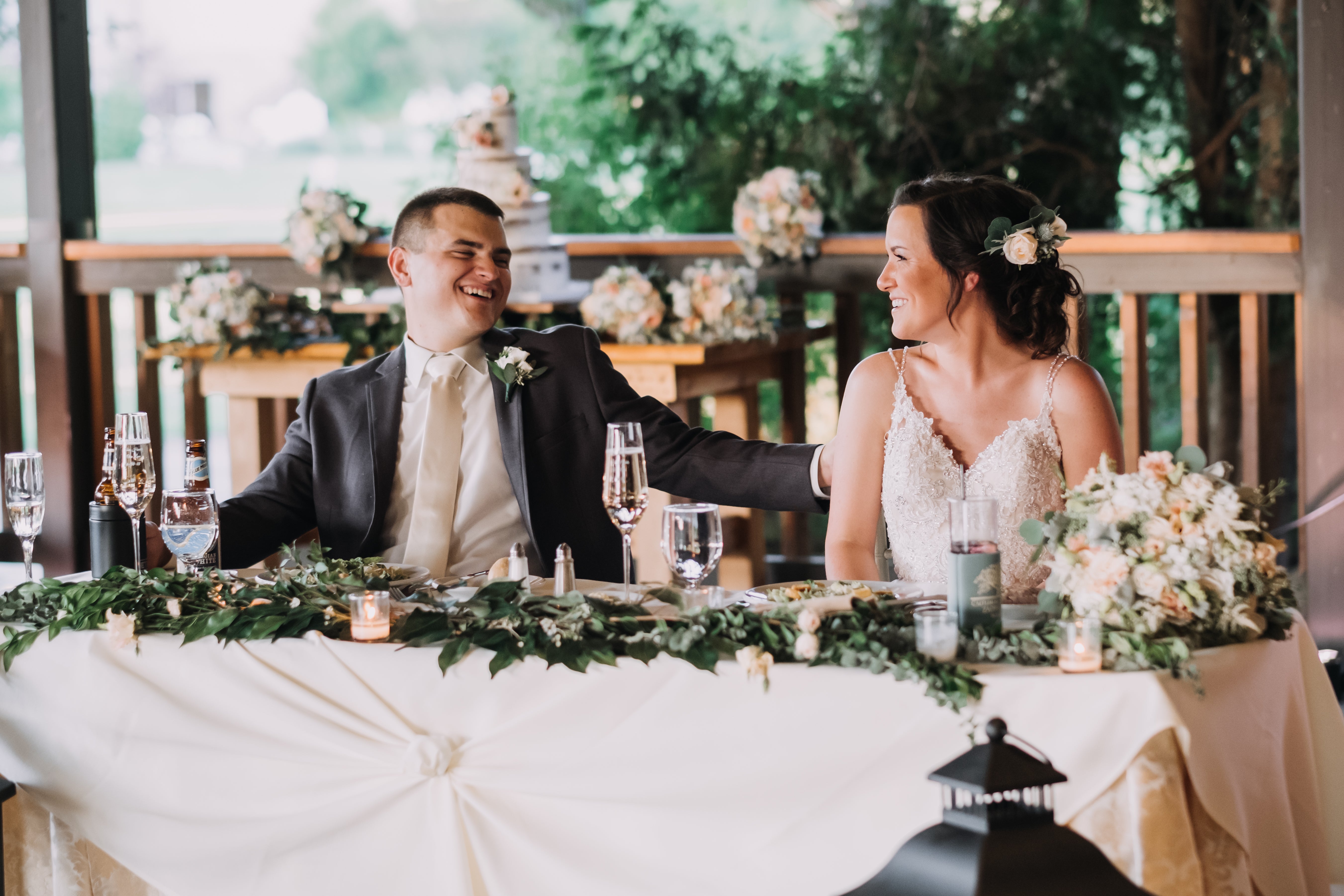 Couple sitting at sweetheart table