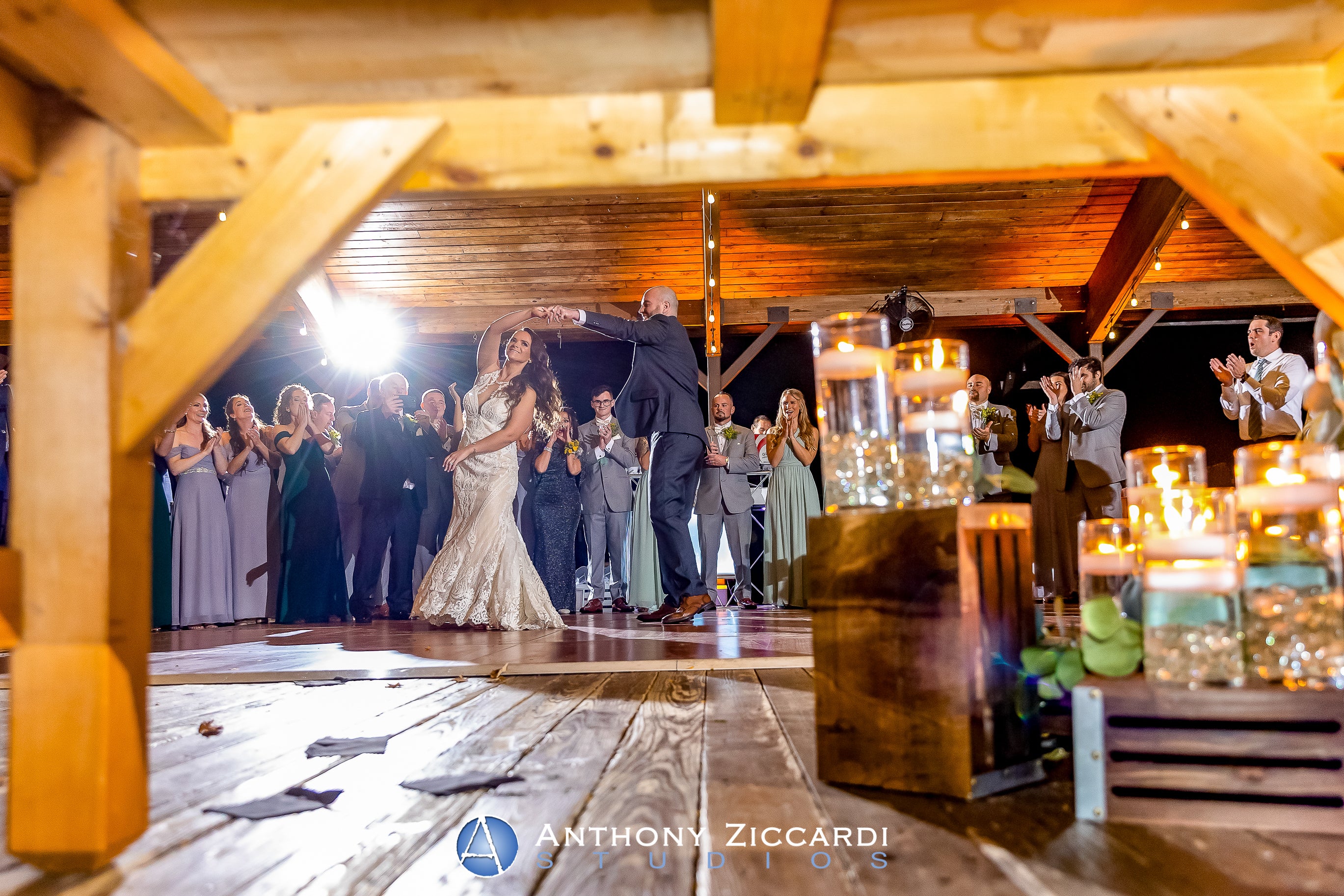 Wedding couple dancing with guests under Sweetgrass Pavilion
