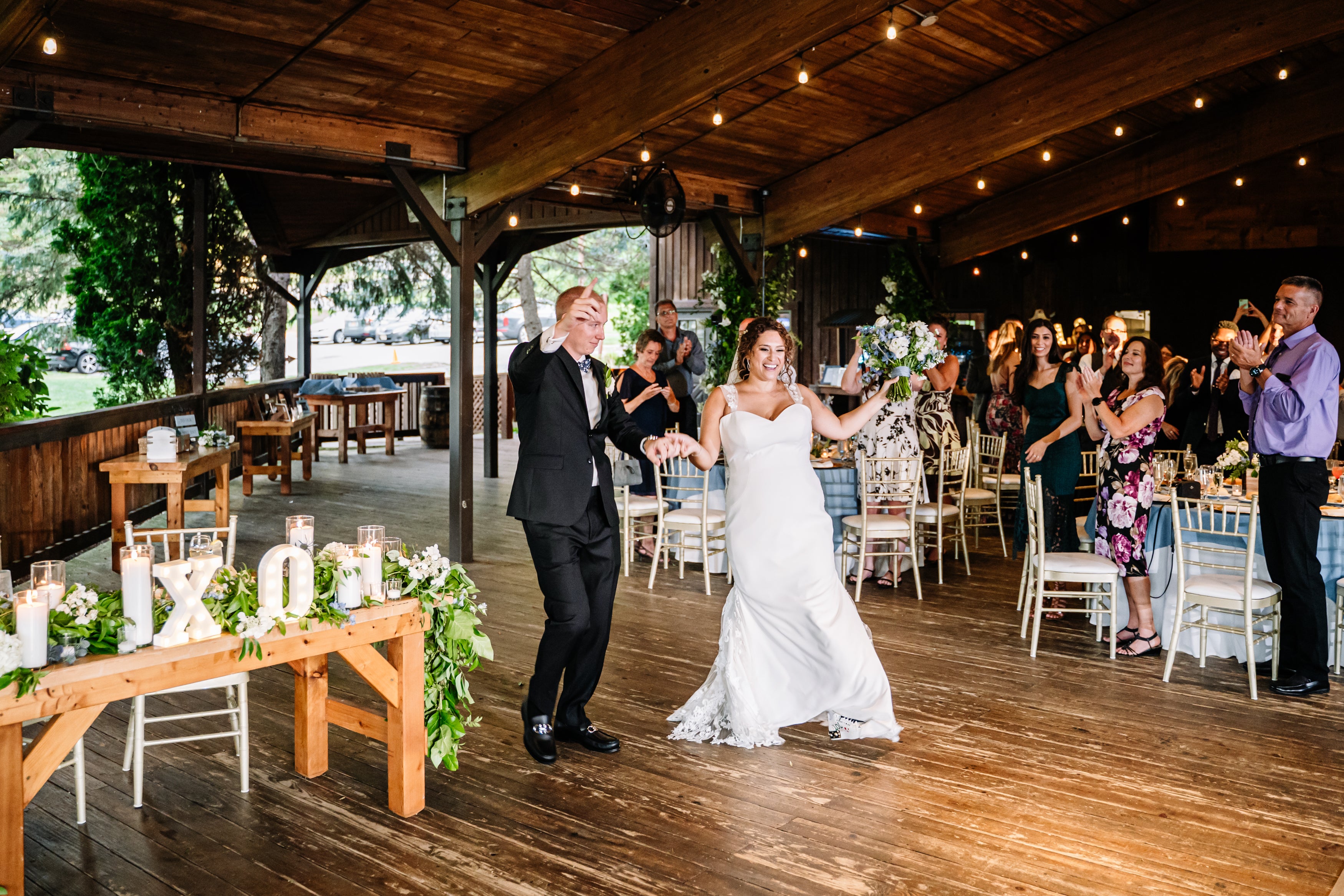 Bride and Groom walking into Sweetgrass Pavilion for entrance