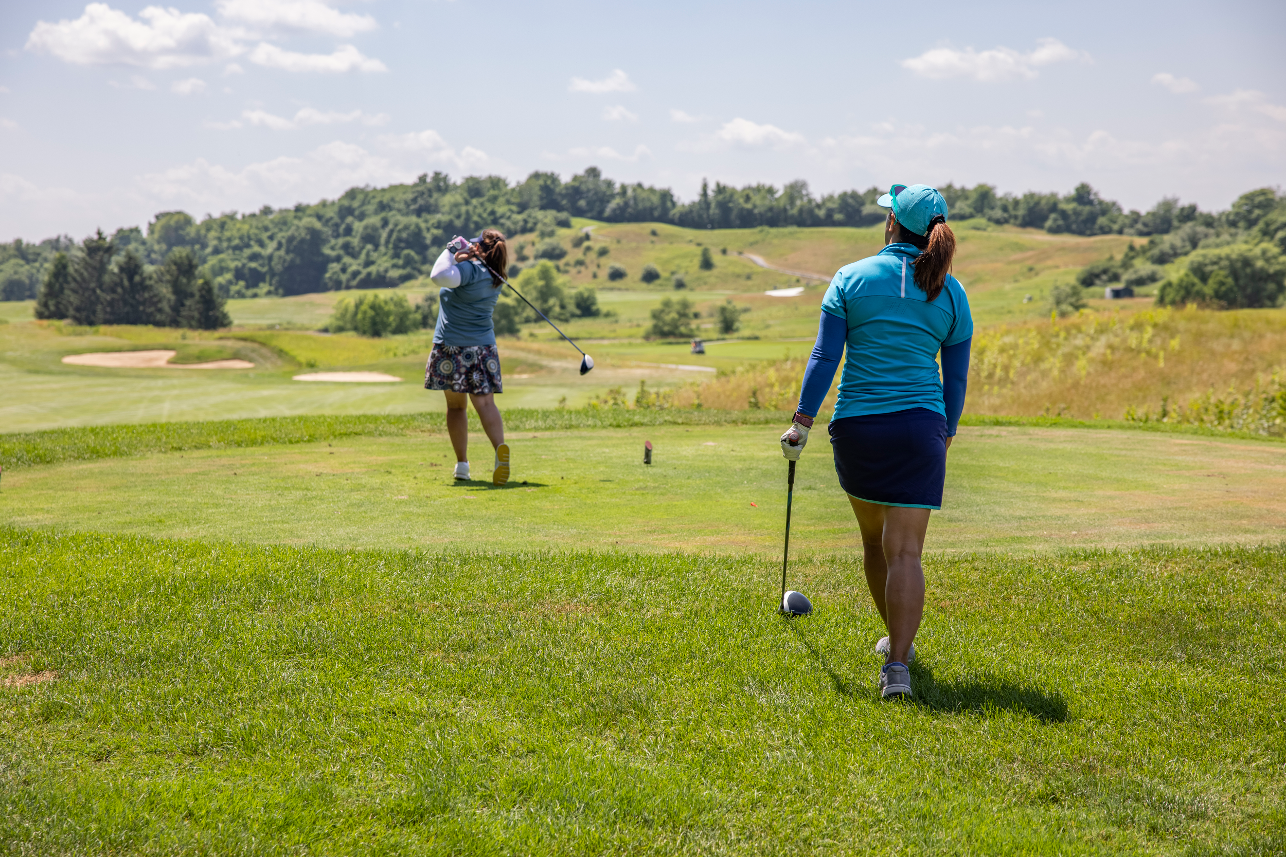 Two women on a golf course at Crystal Springs Resort