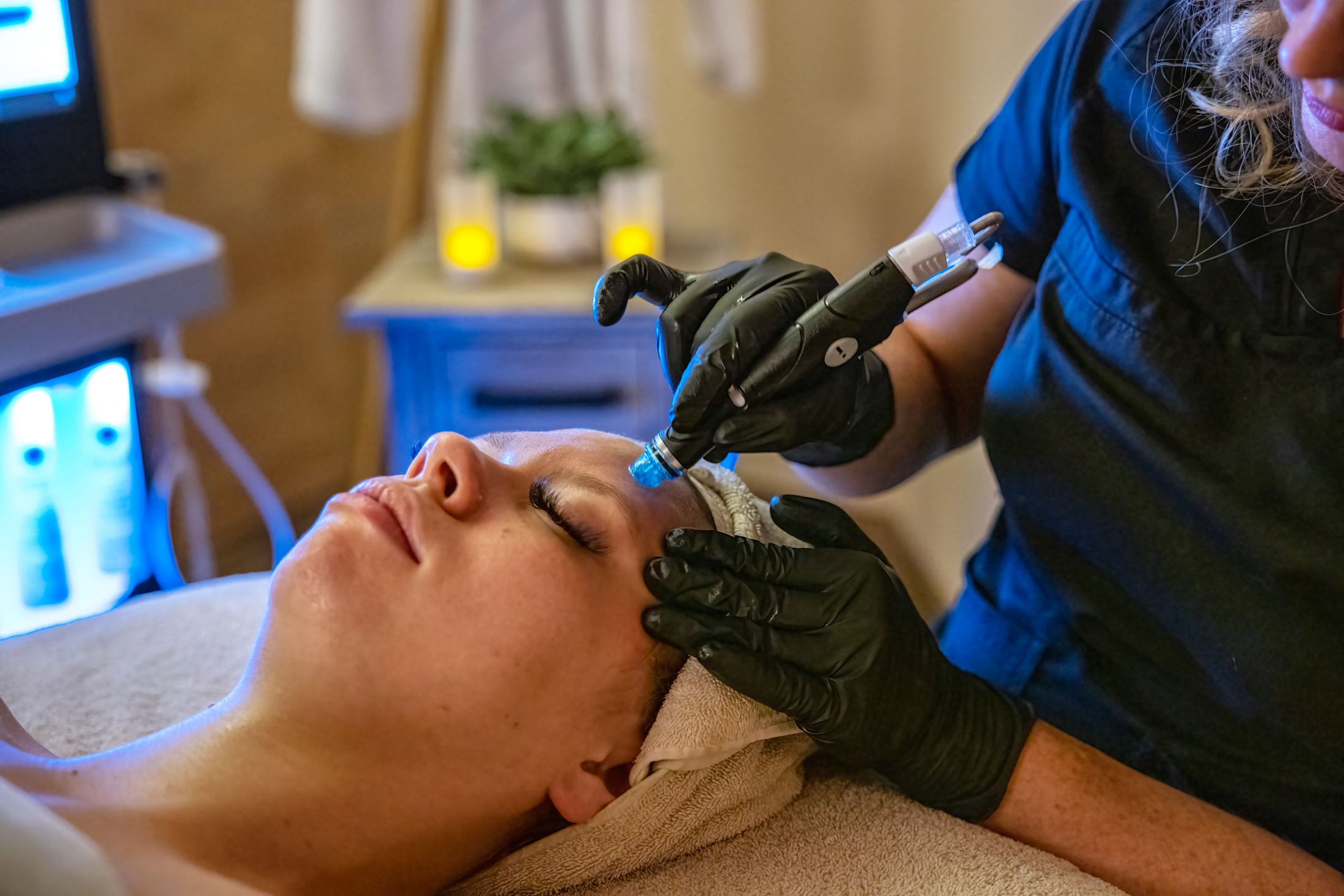 Woman receiving hydrafacial.