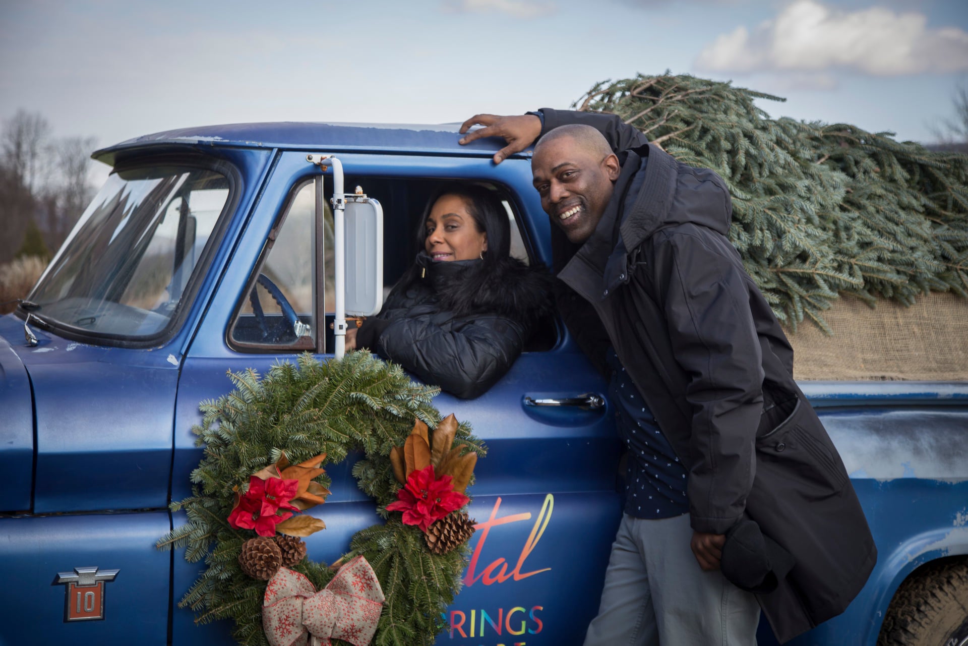 Couple Christmas photo in Crystal Springs Resort blue truck
