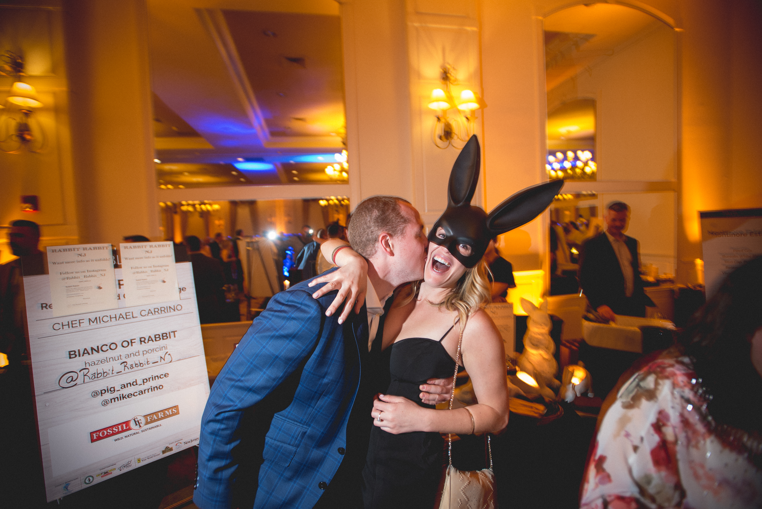 Couple on NYE with girl wearing rabbit mask