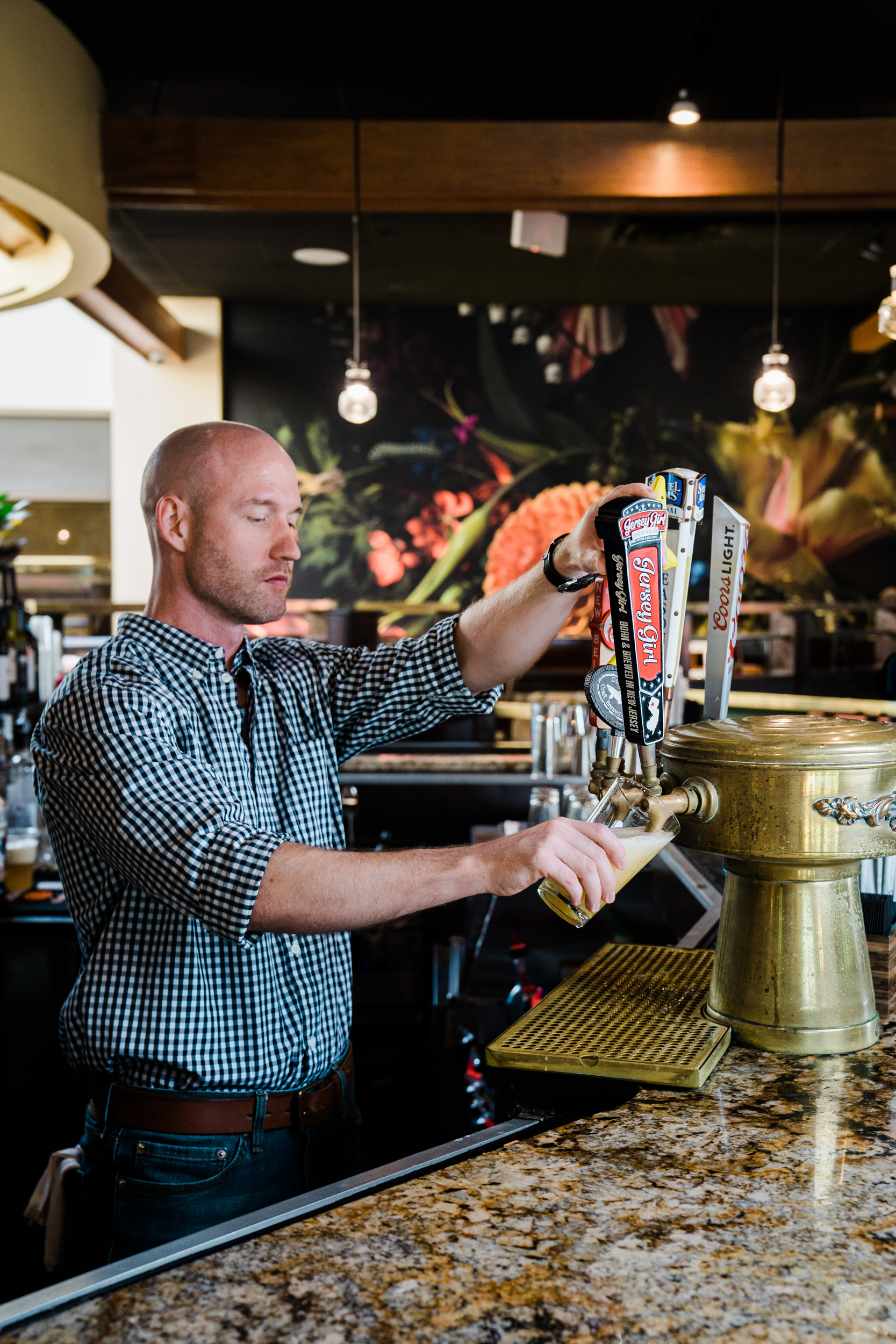 Bartender pouring draft beer at Kites Restaurant