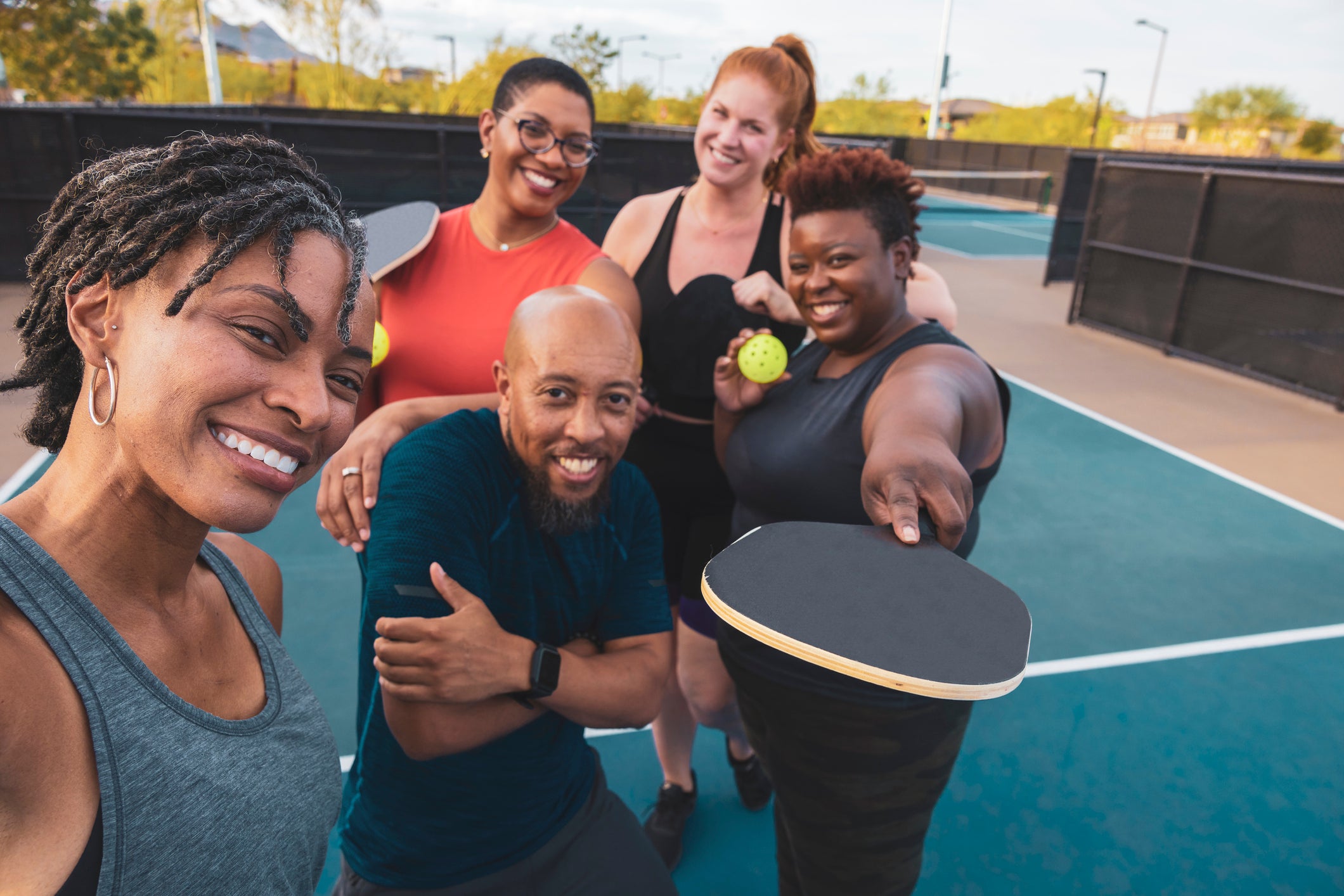 Group of friends playing pickleball.