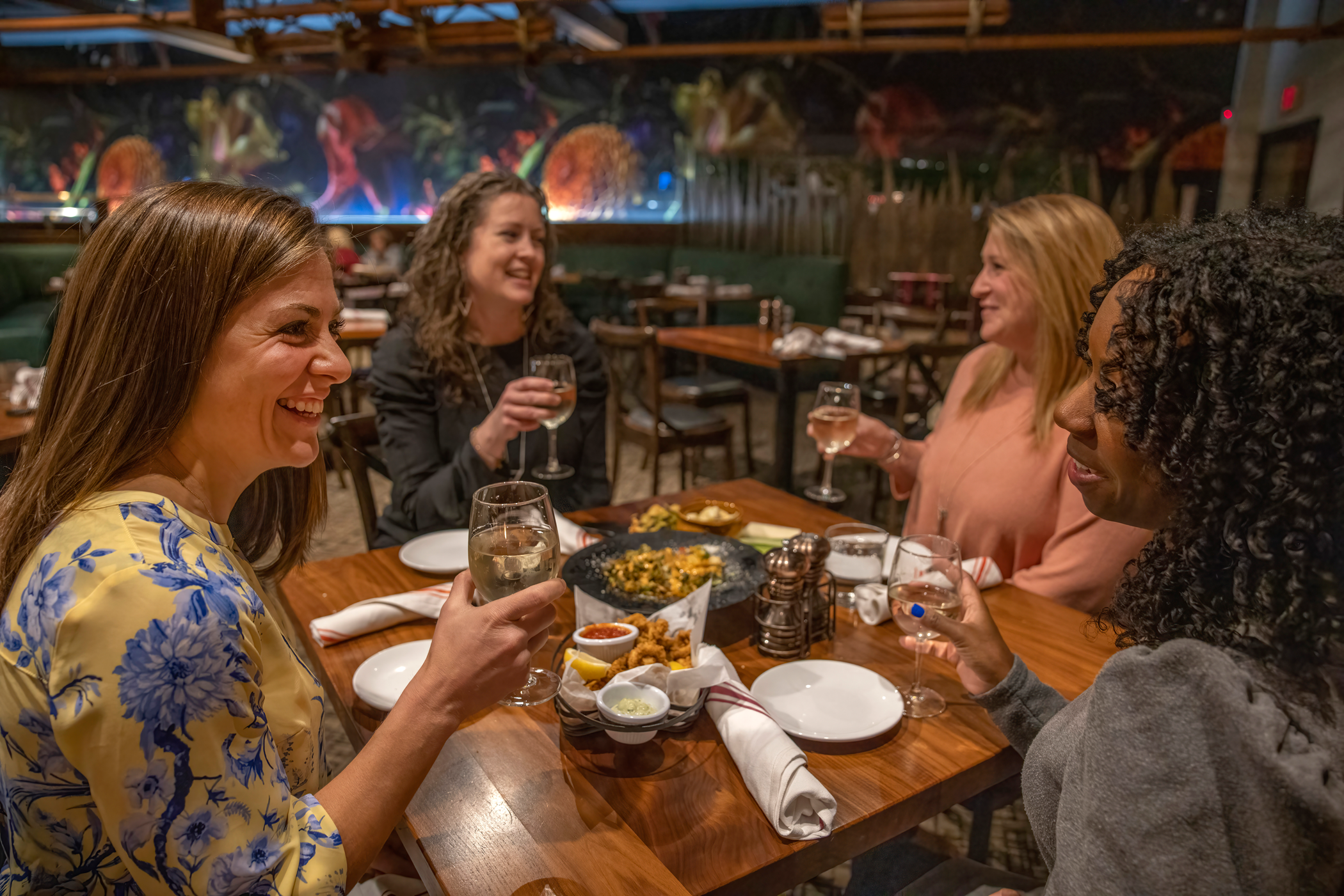 Four girlfriends dining inside at Kites Restaurant
