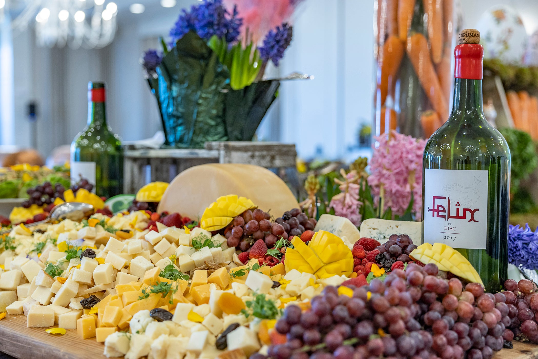 Food display of fruit and cheese.