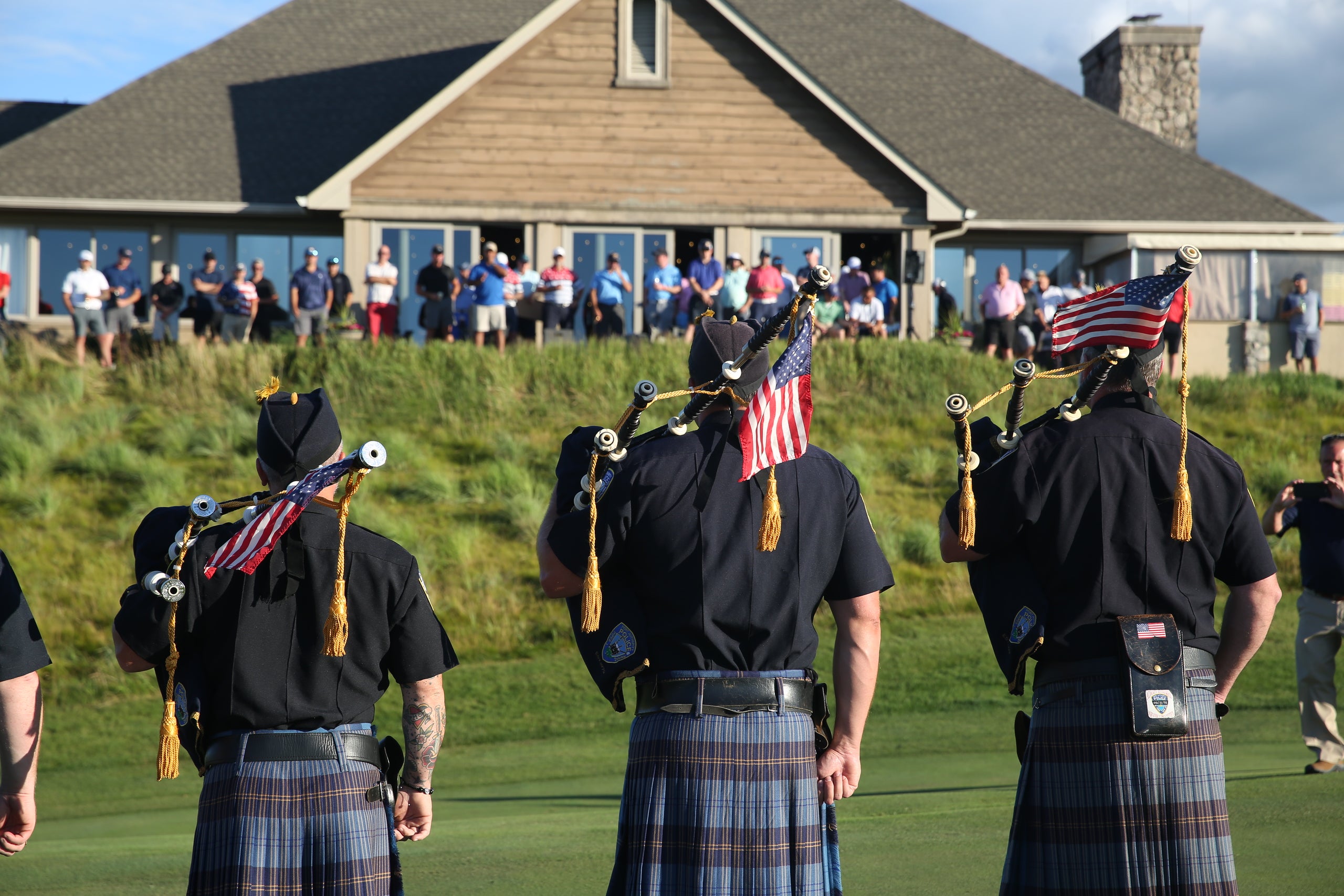 Bagpiper band at a golf event.