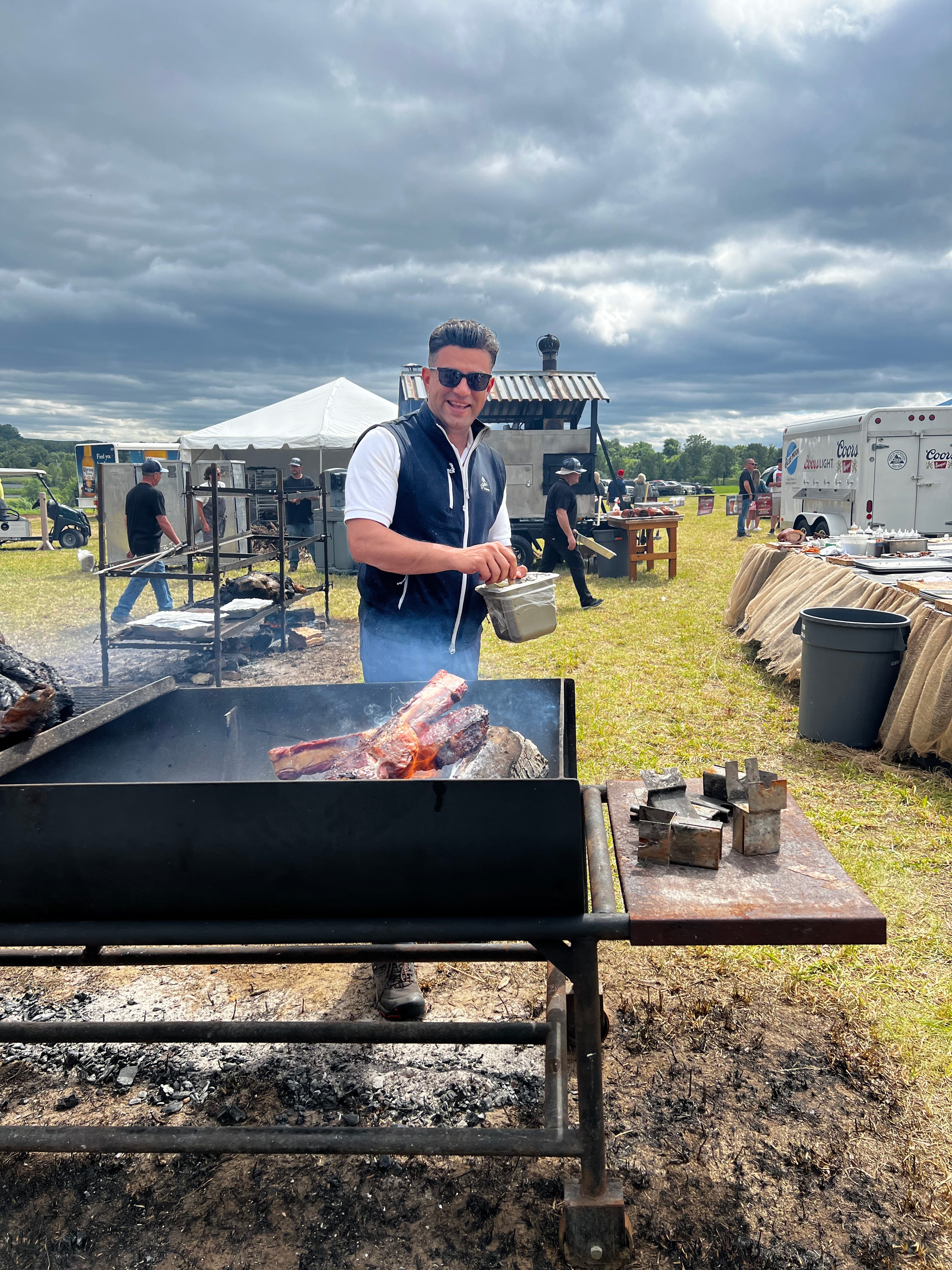 Open fire cooking meat at NJ Beer &amp; Food Festival