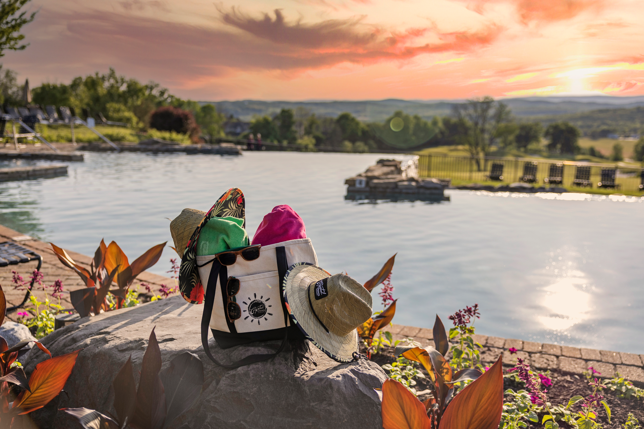 Beach bag bundle of two towels, two hats and sunglasses  at Vista 180 pool.