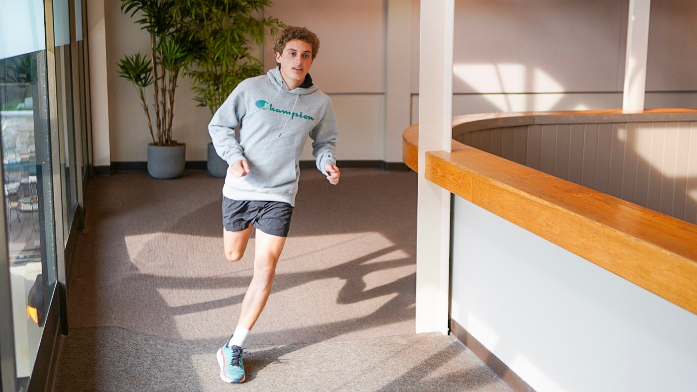 Man running on indoor running track at Minerals Sports Club.
