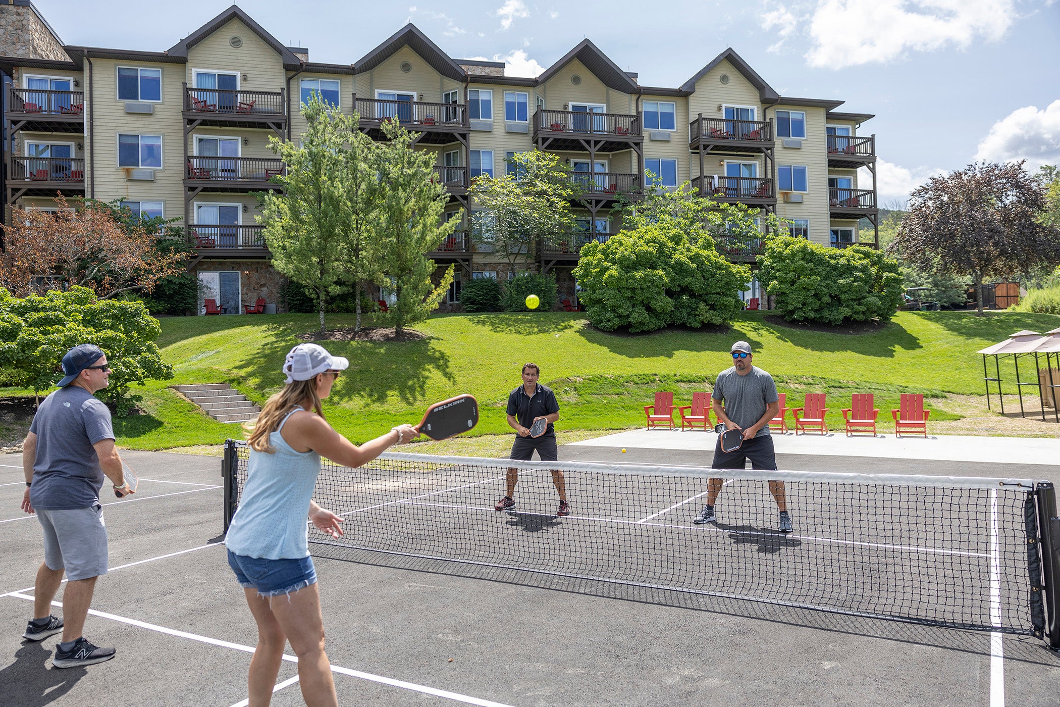 Family playing pickleball.