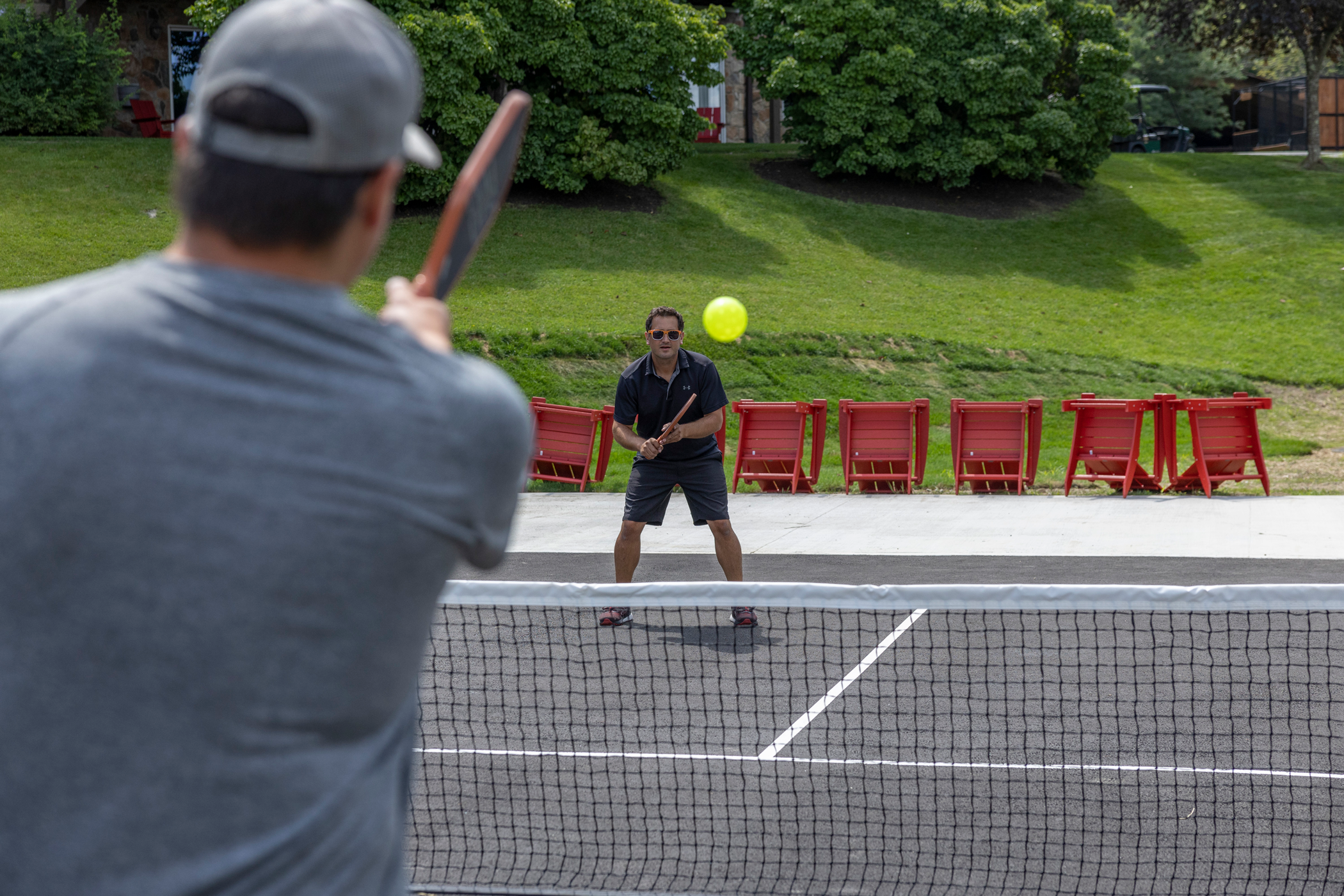 Two men playing pickleball.