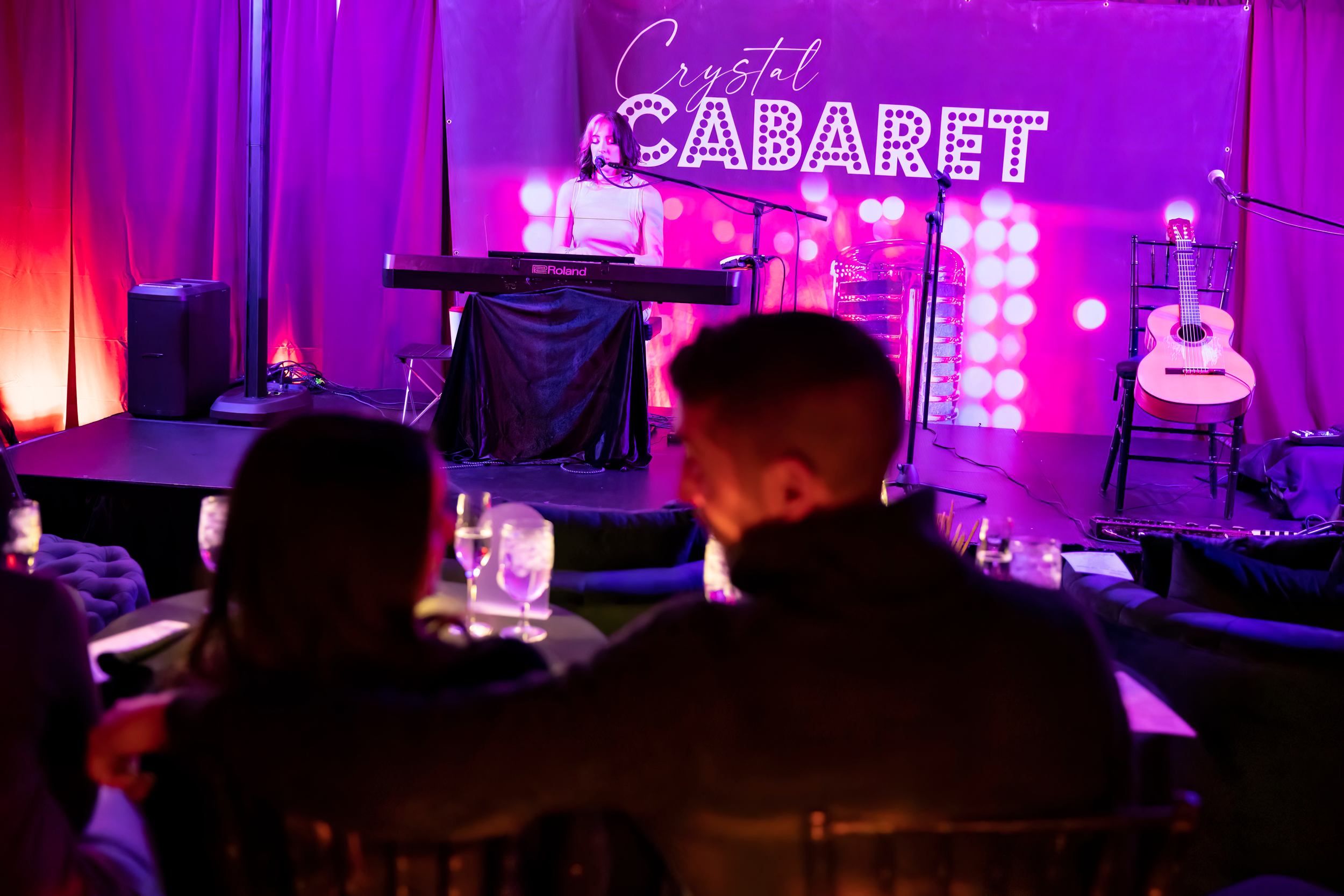 Couple sitting in crowd at Crystal Cabaret.