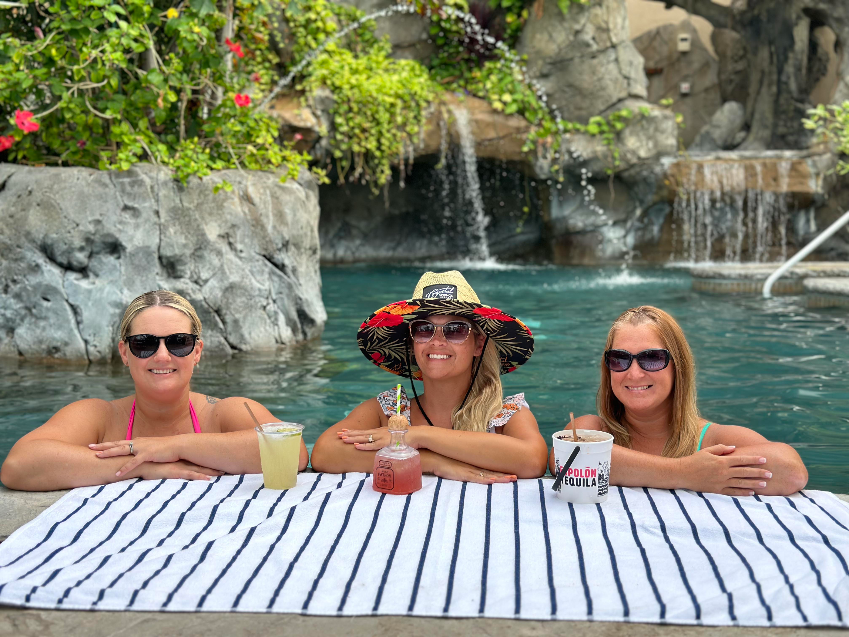 Girlfriends in Biosphere pool drinking tequila.