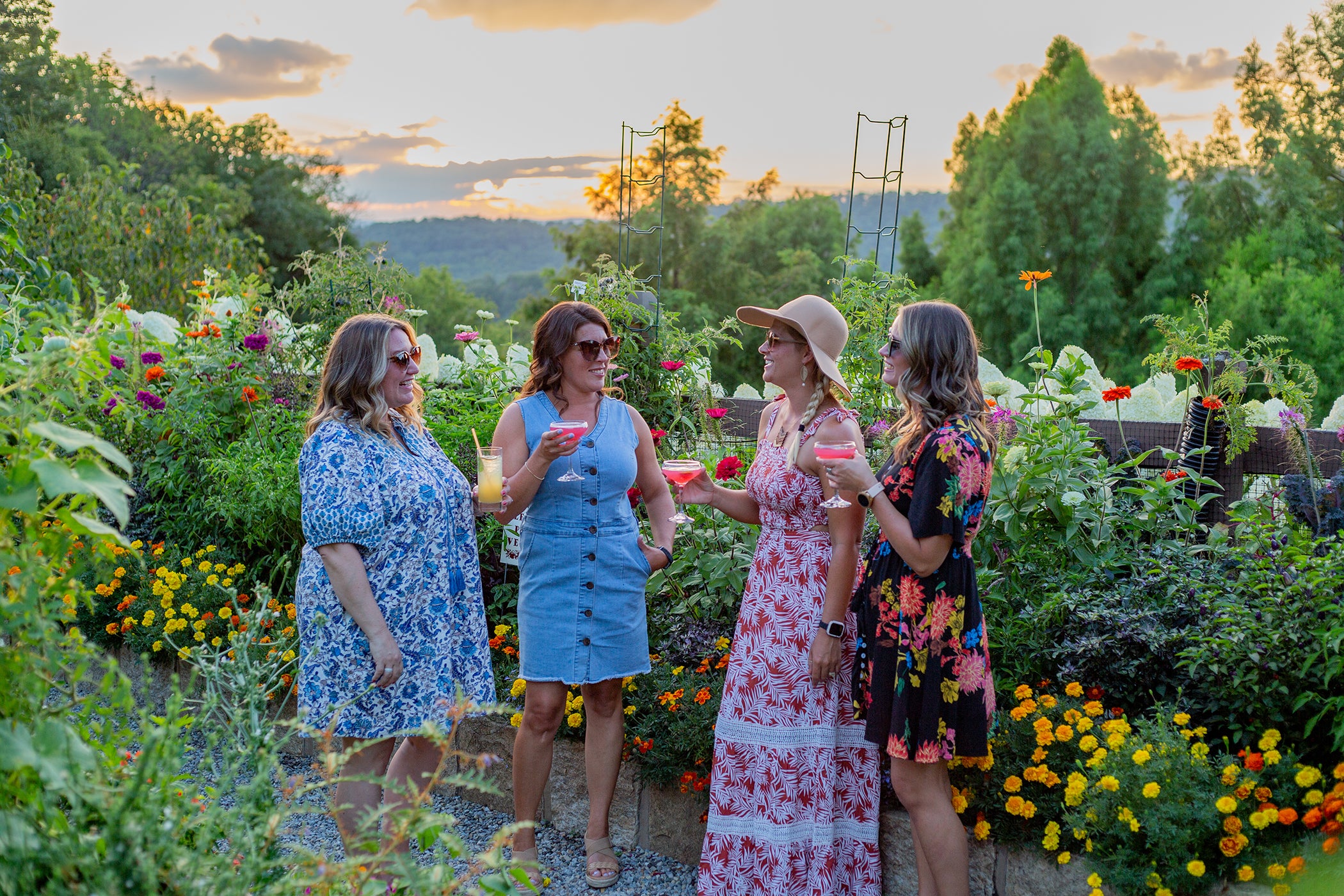 Group of 4 girlfriends standing in Chef's Garden.