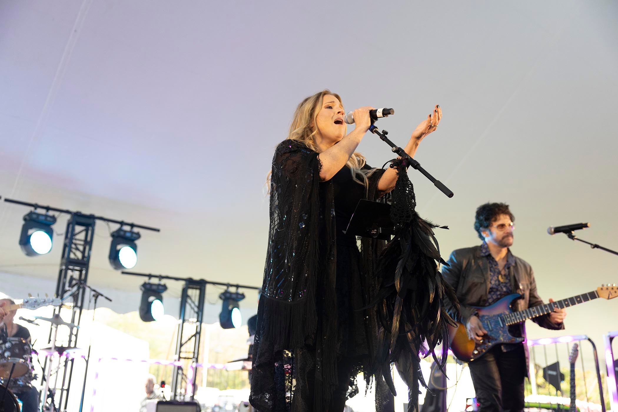 Lead singer of Gypsy singing on stage at Music Fest