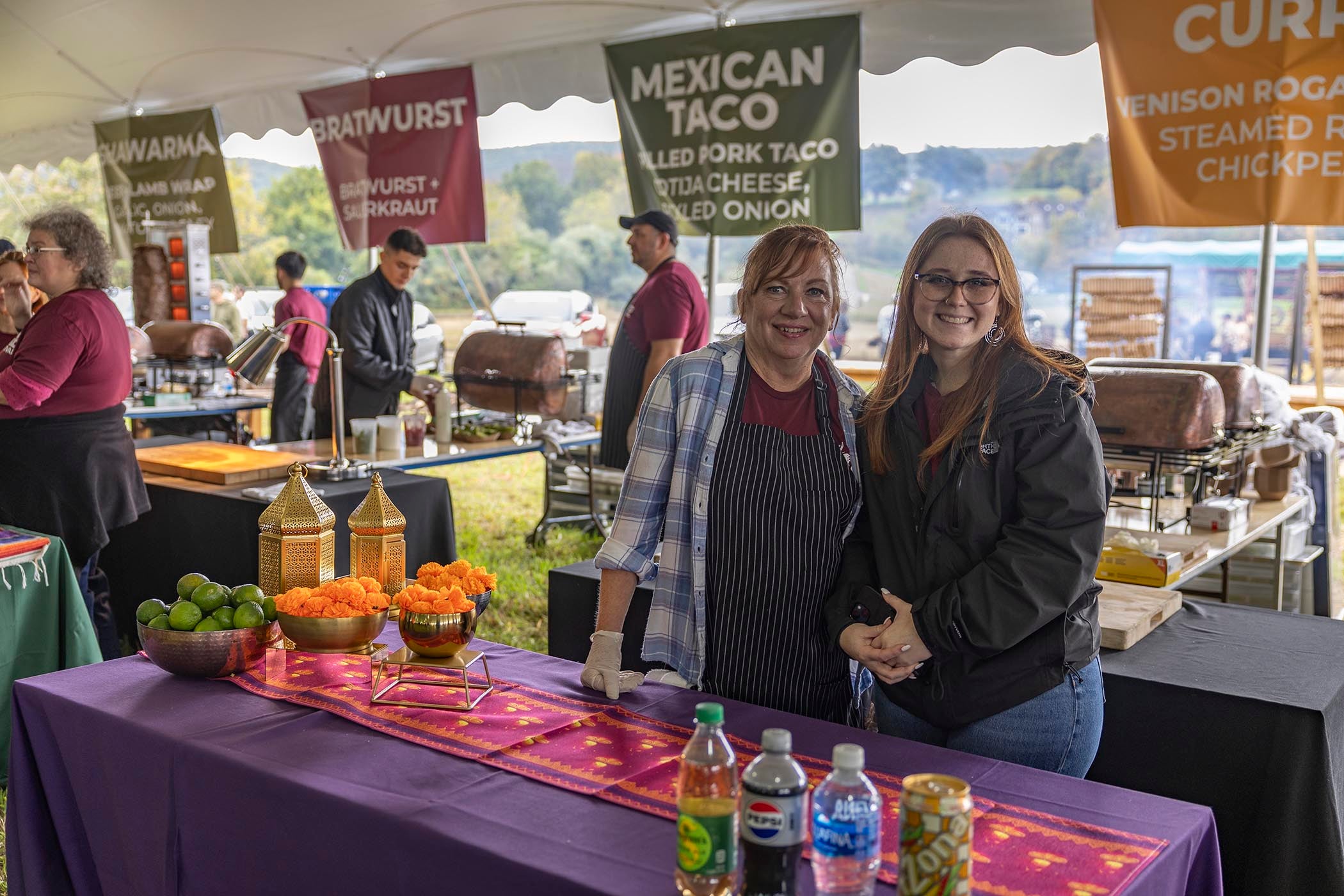 Two woman helping to pass out food at Music Fest.