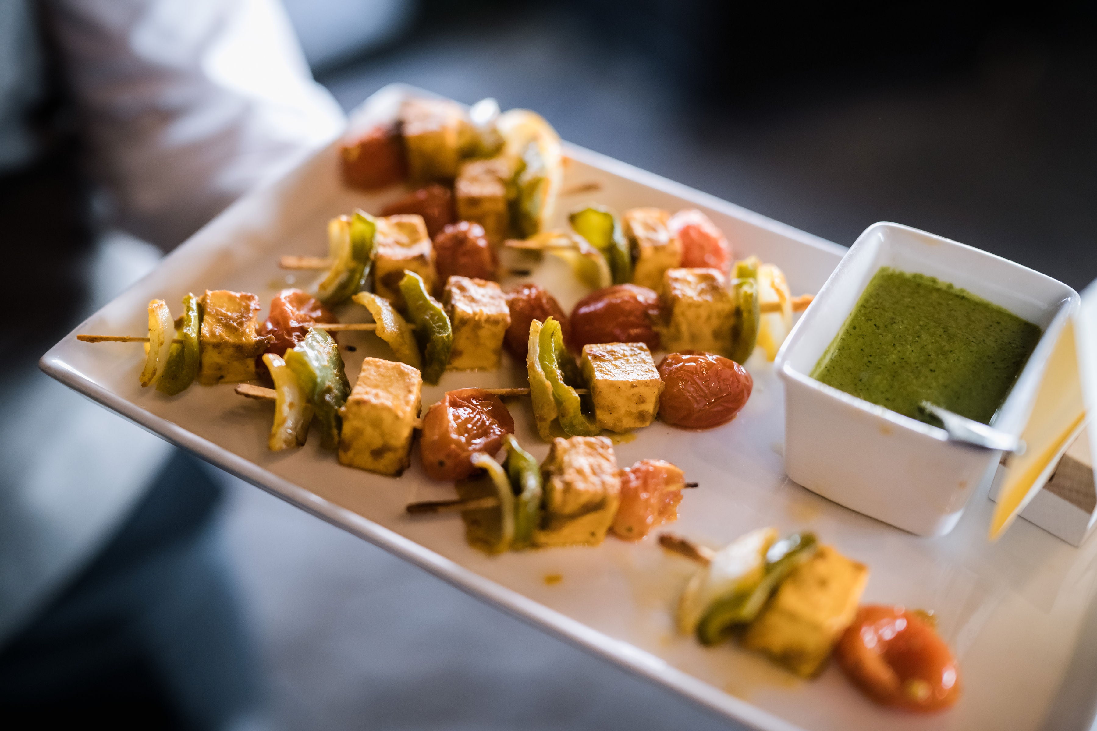 Kebab served on plates during cocktail hour.
