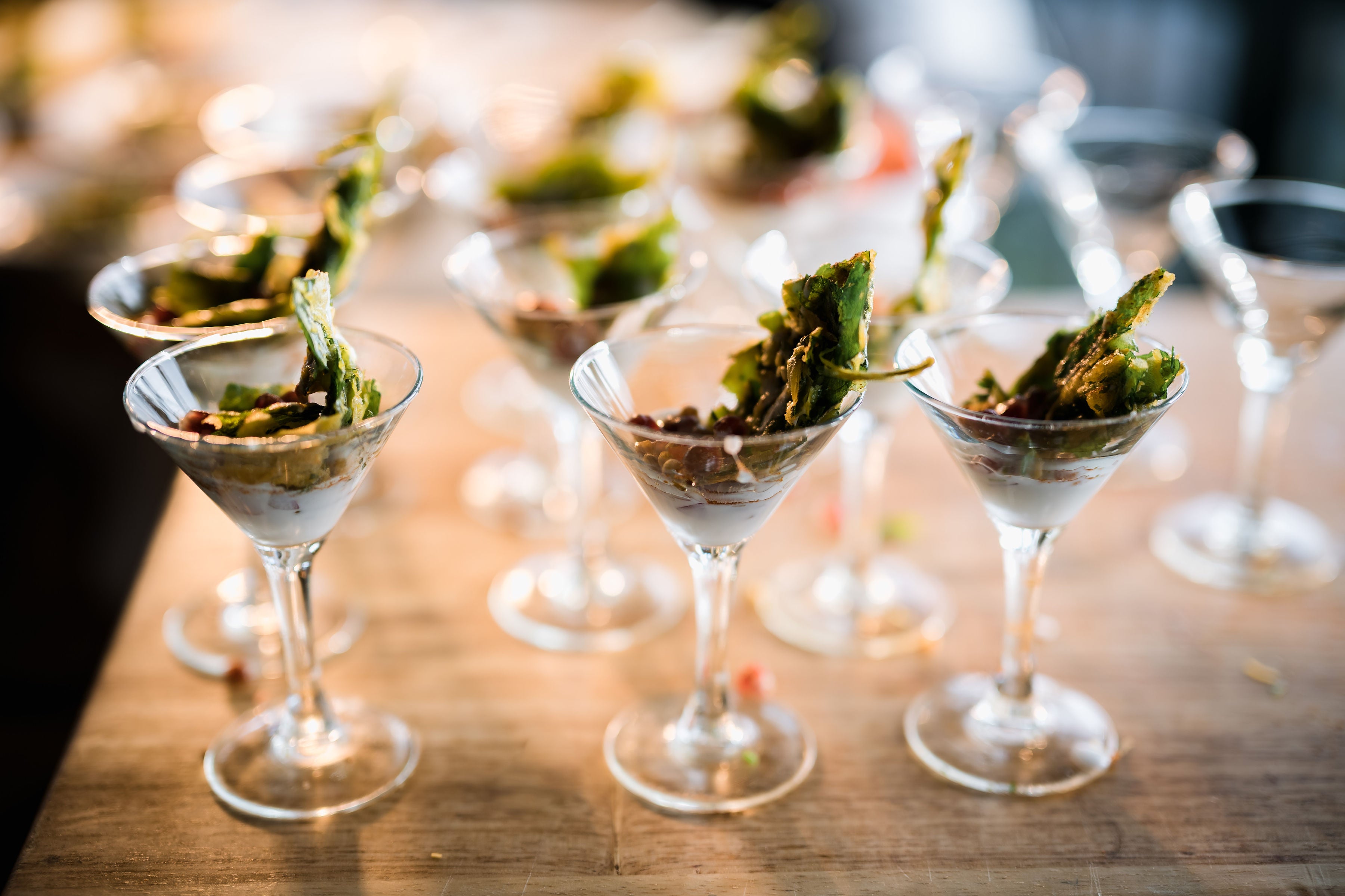 Snacks in martini glasses.