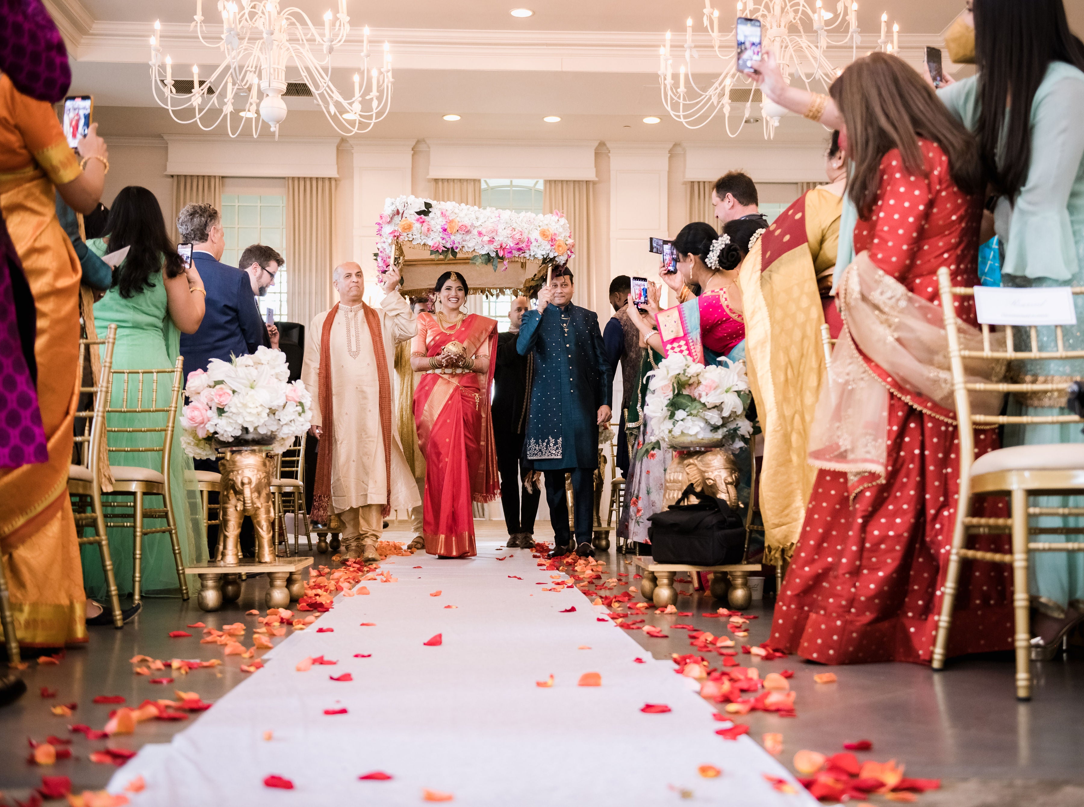 Bride walking down aisle during ceremony.