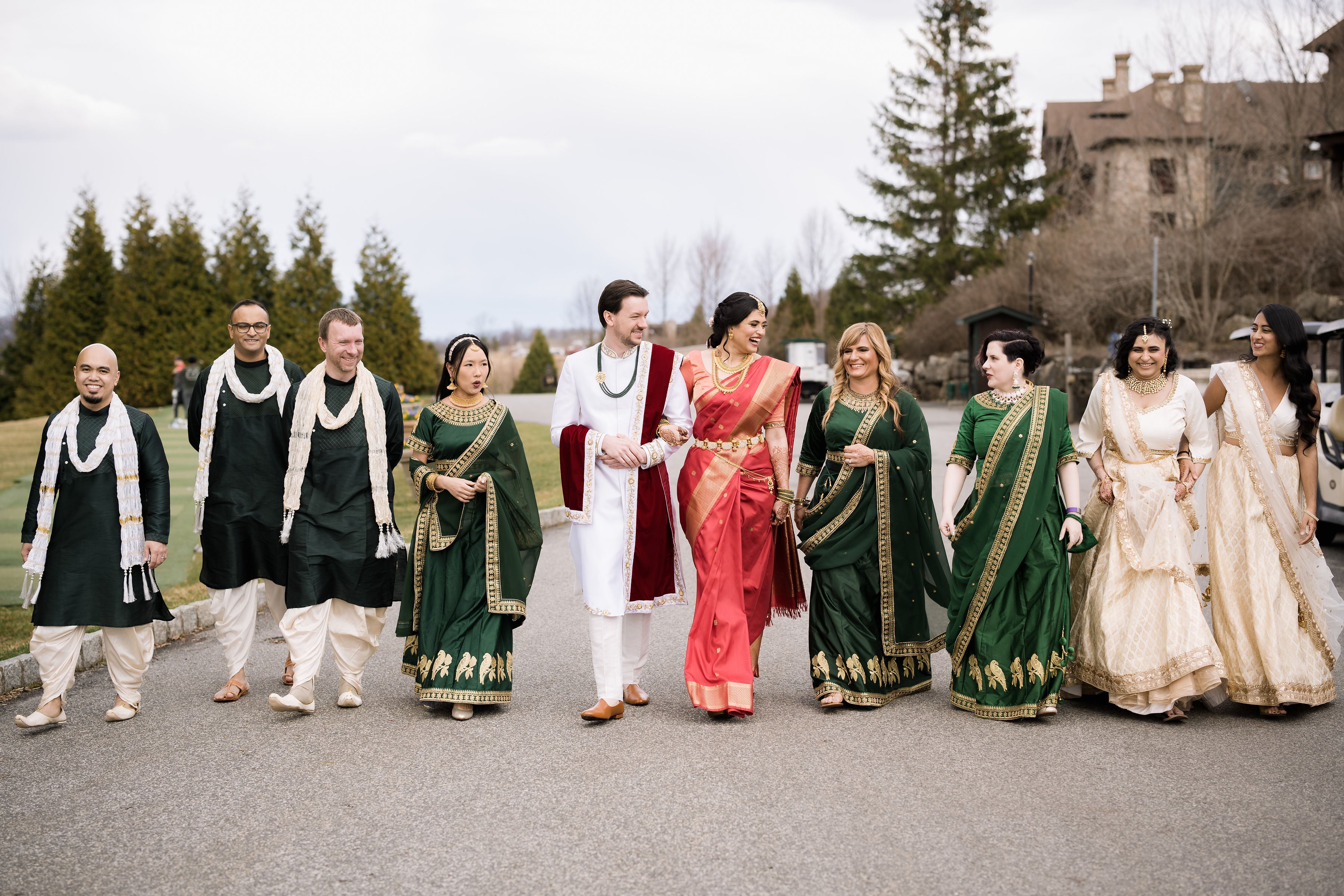 Indian wedding party with bride and groom walking near Crystal Springs Clubhouse