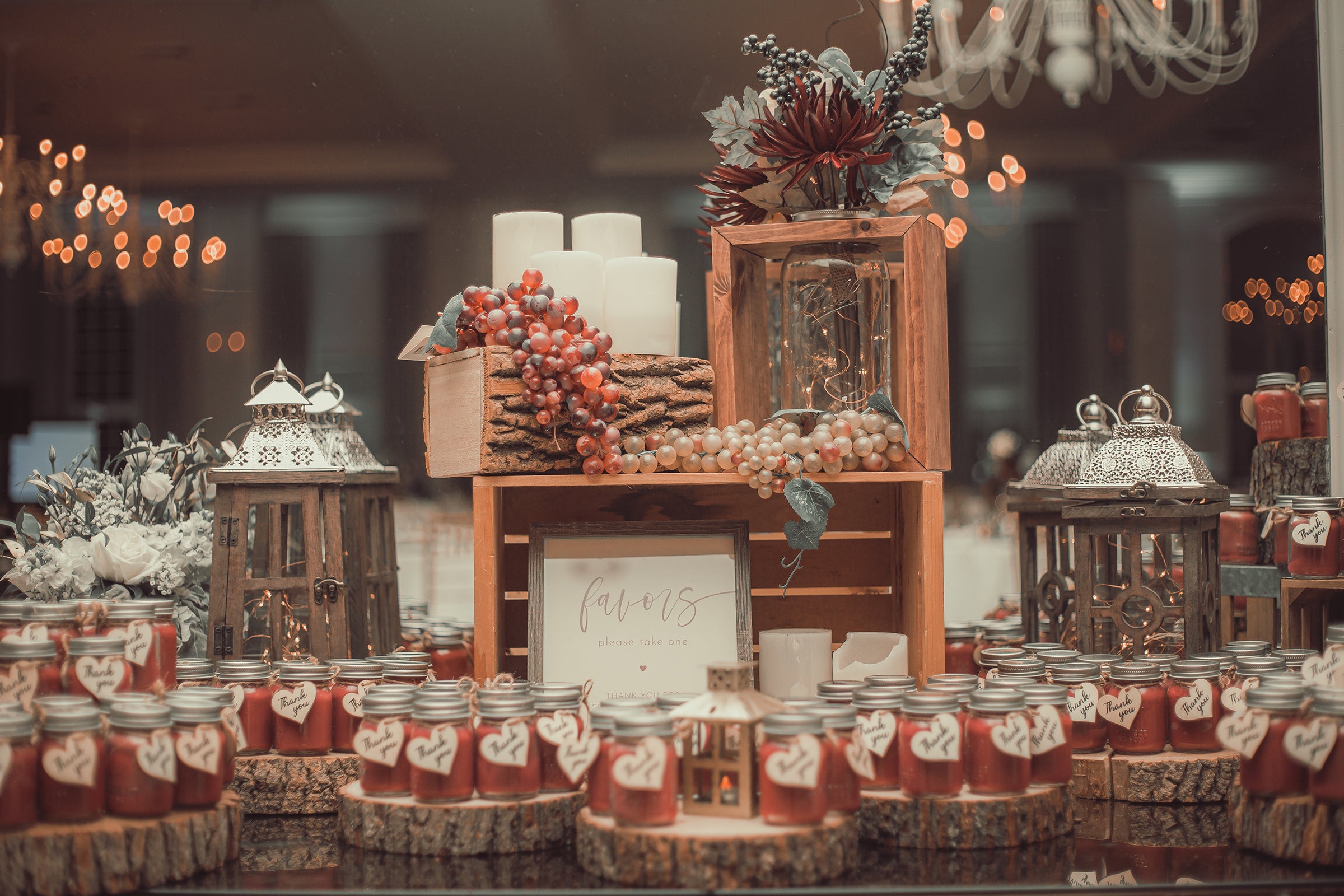 Table of wedding favors in cans. 