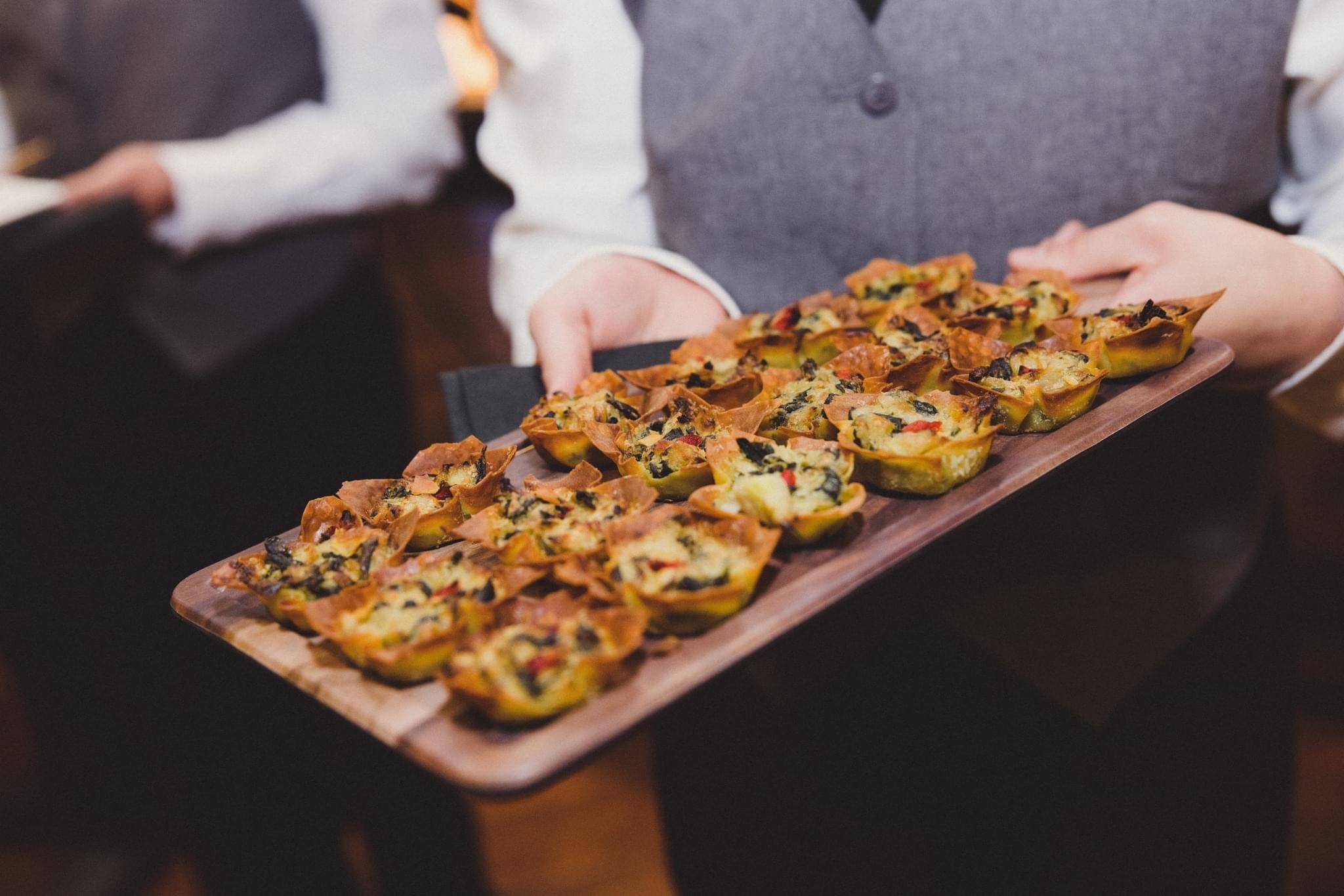 Waiter holding Hors d'oeuvres platter